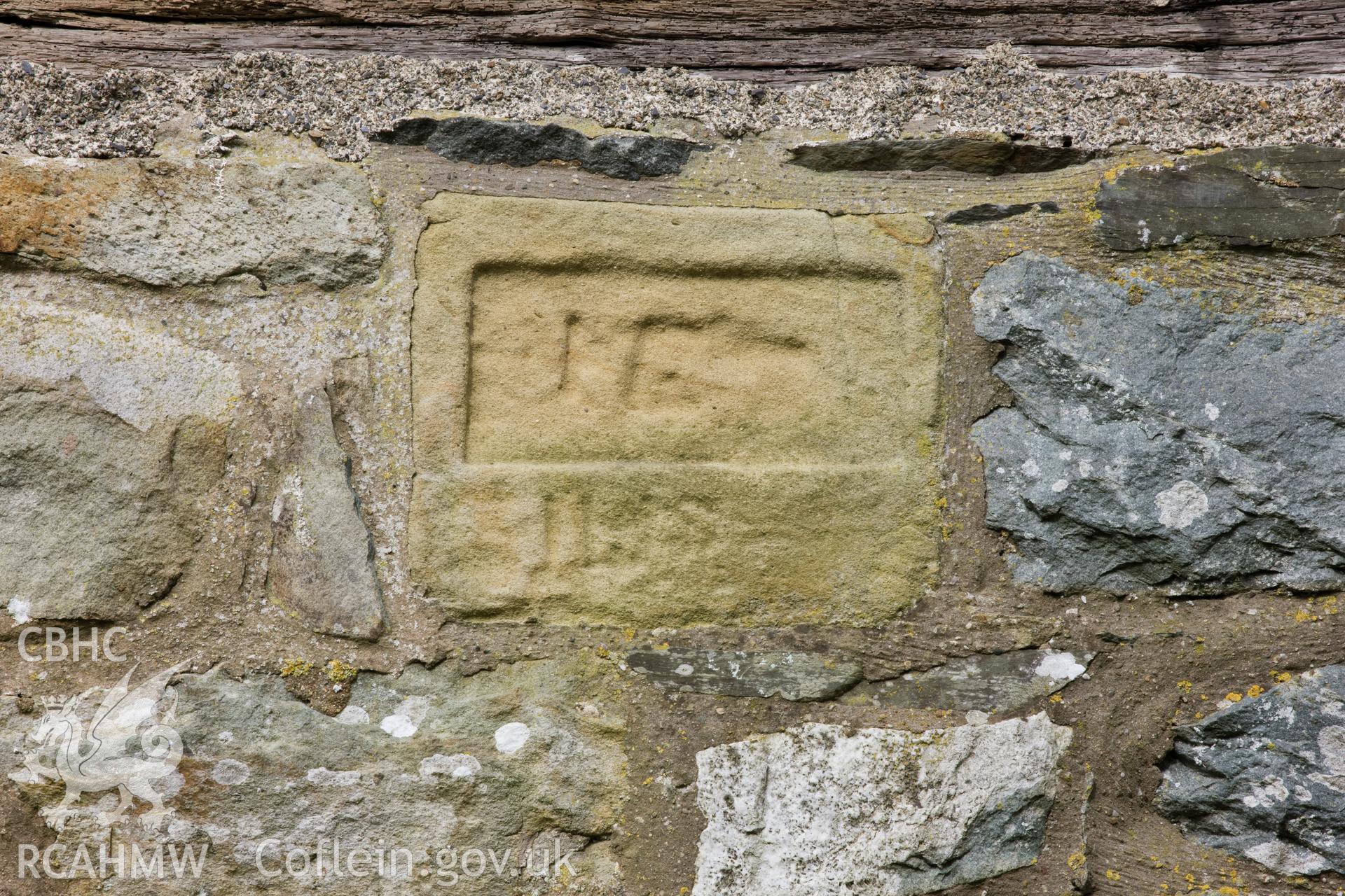Inscription/date stone on southwest elevation.