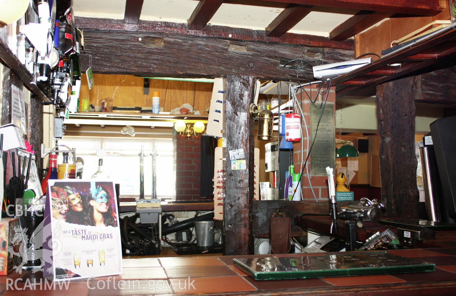 Interior, ground-floor parlour room looking at north wall framing through bar.