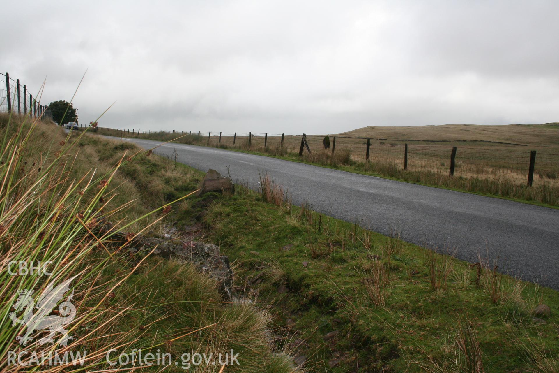 View of stone with nearby stone Maen Llia (NPRN 84541) in the background.