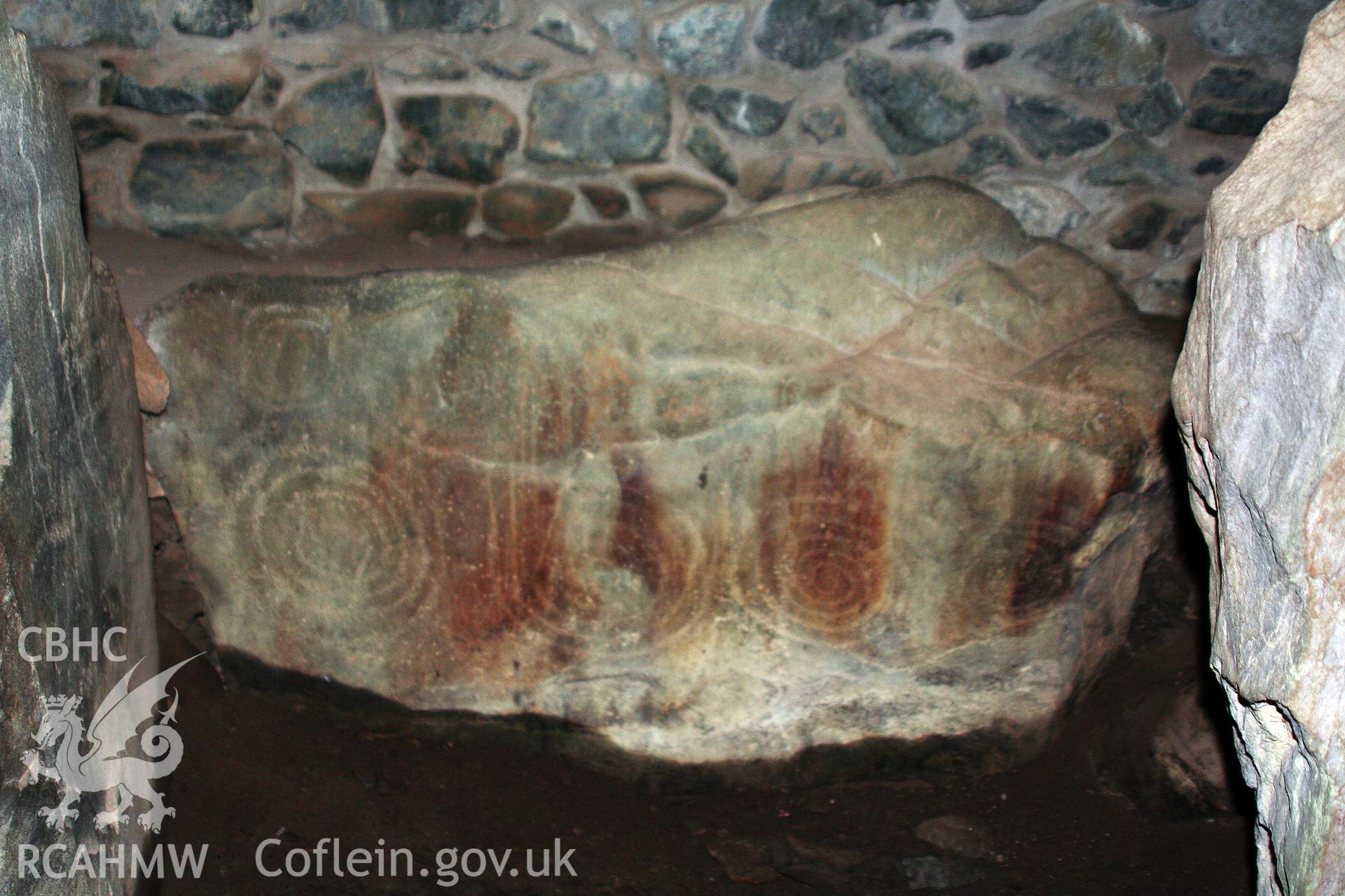 View of spiral decorated rear slab in eastern side chamber, flanked by slab with newly-recorded rock art.
