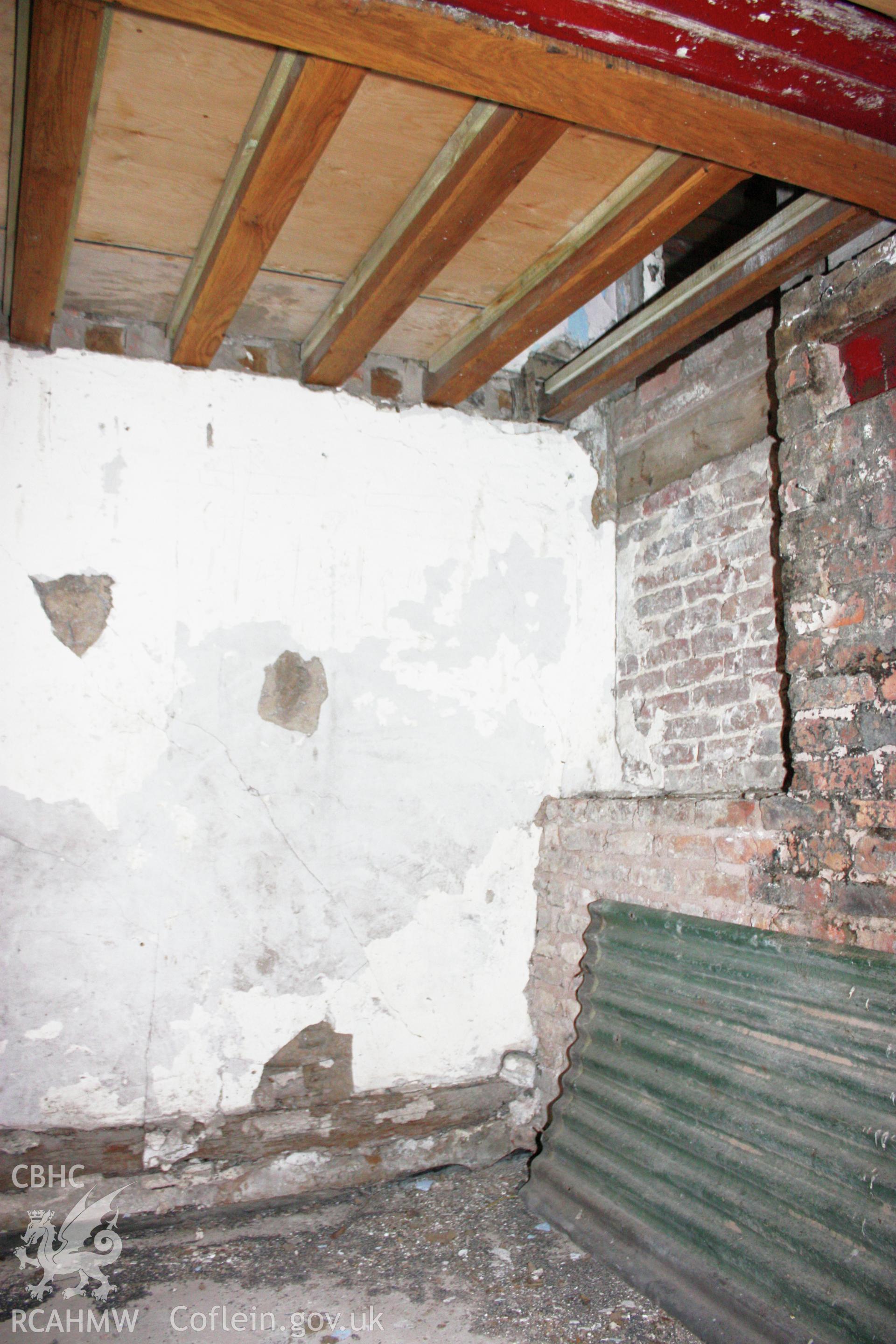 Interior, showing timber-frame truss-partition behind cross-passage with timber-frame to south-east elevation.