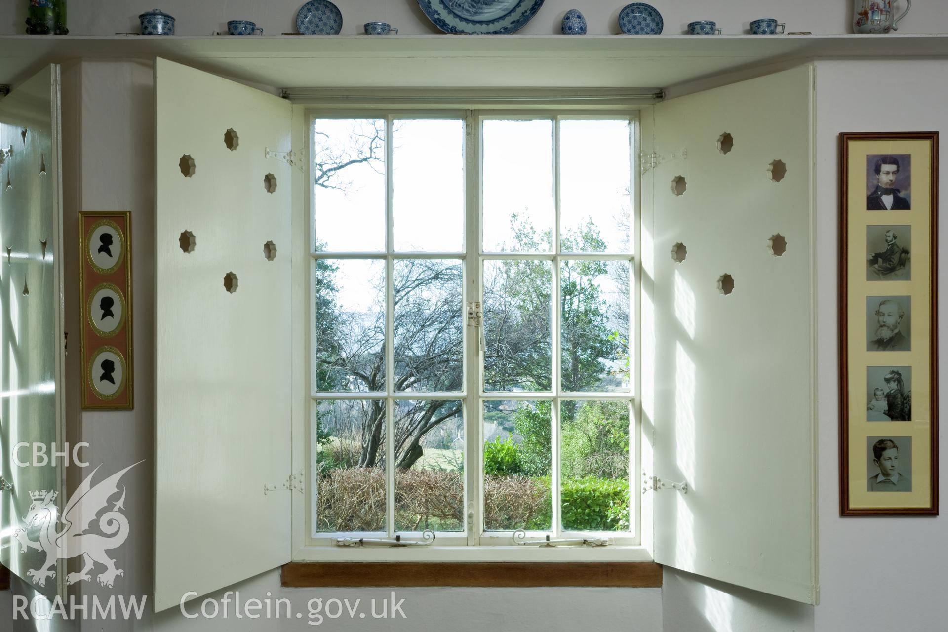 Living-room, window and shutter detail.