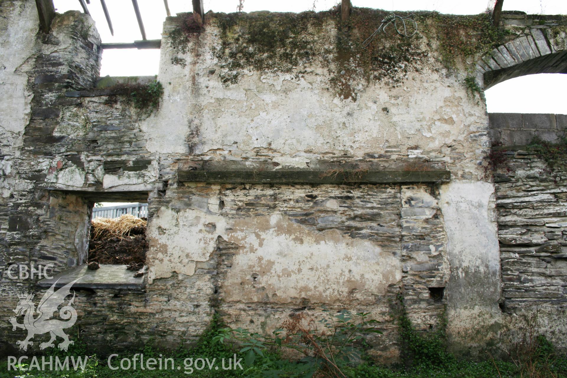 Barn interior, west wall, former threshing-doorway.