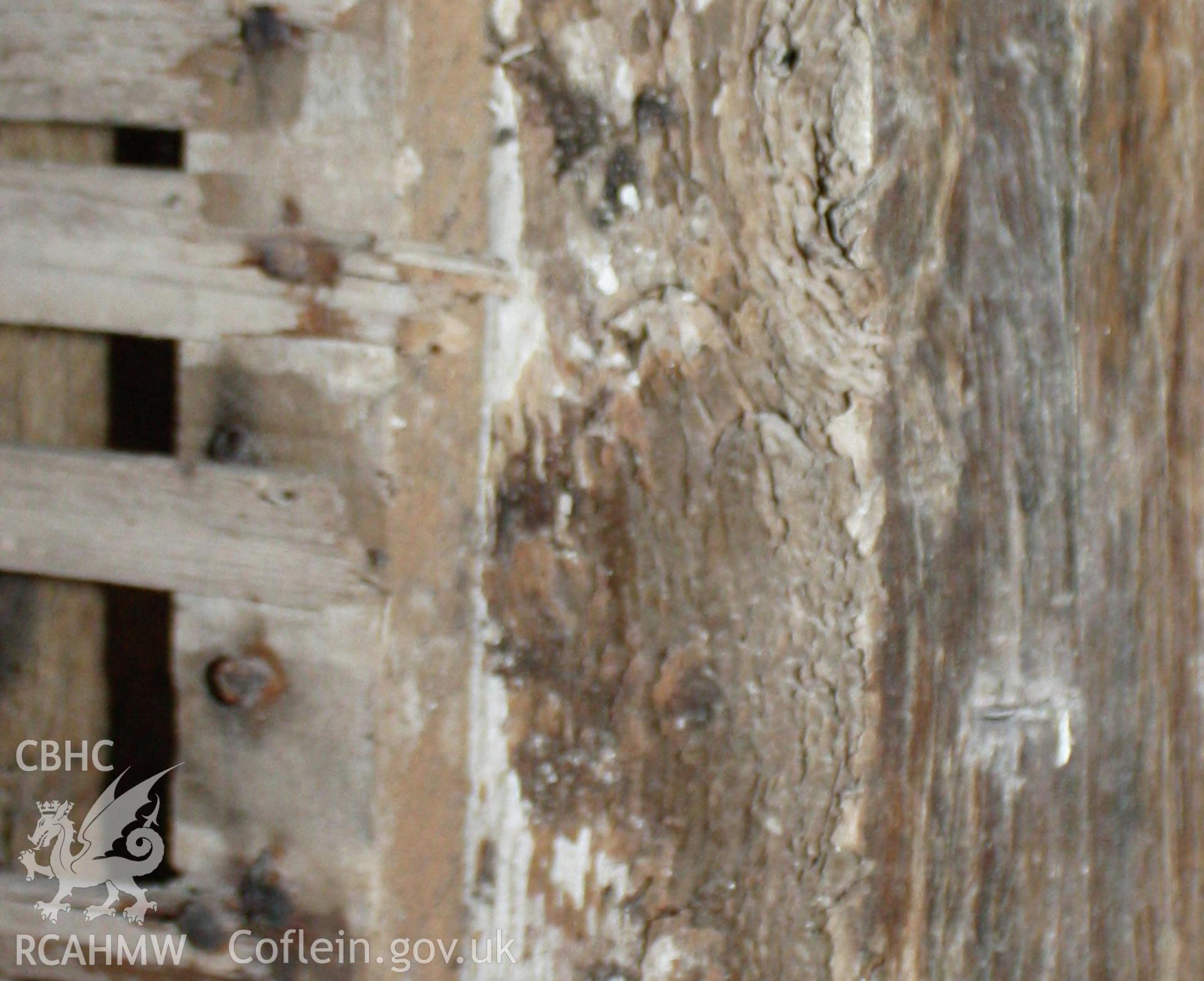 Interior, showing assembly marks on timber-frame to south-east elevation by left side of entrance doorway.