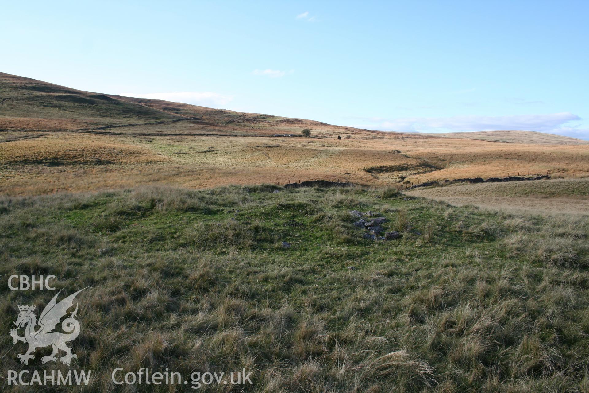 Cairn viewed from the south-east; Maen Llia (NPRN 84541) in the distance, below horizon.