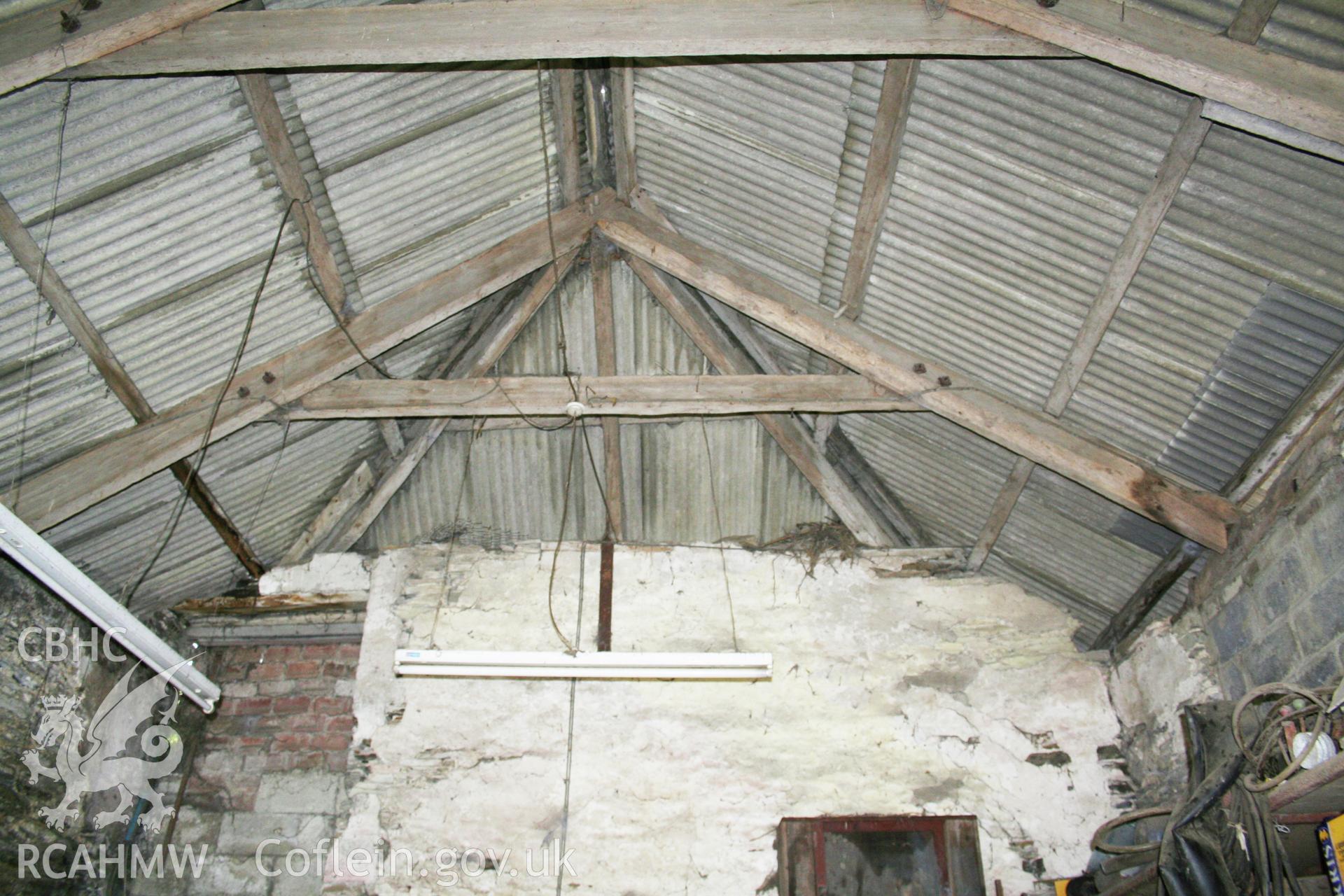 Stable to barn interior, showing hip-roof  at east end.