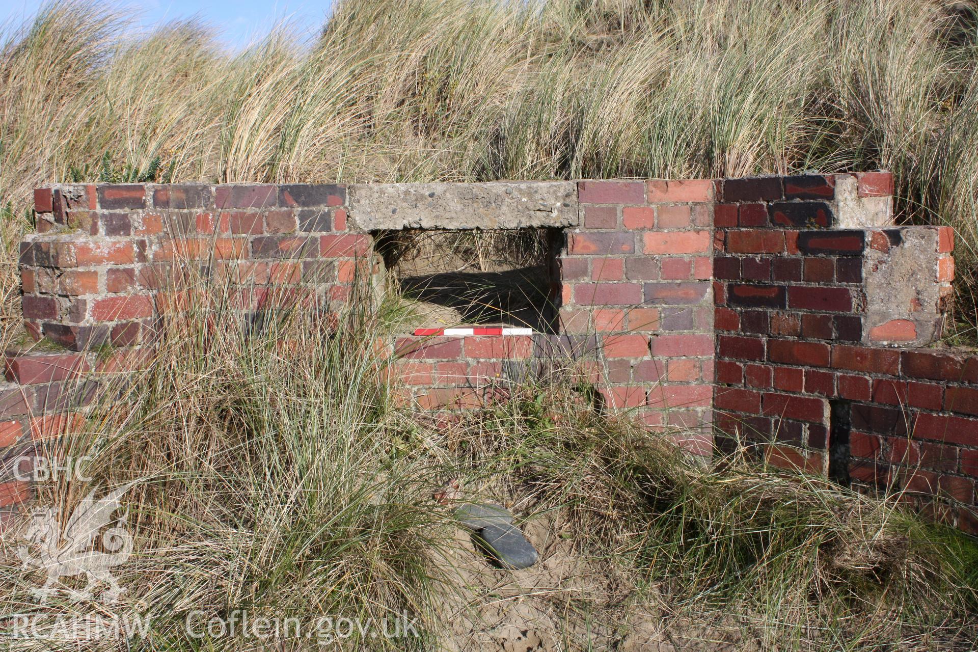 Detail of lintel spanning observation/firing slit from interior of pillbox with photoscale