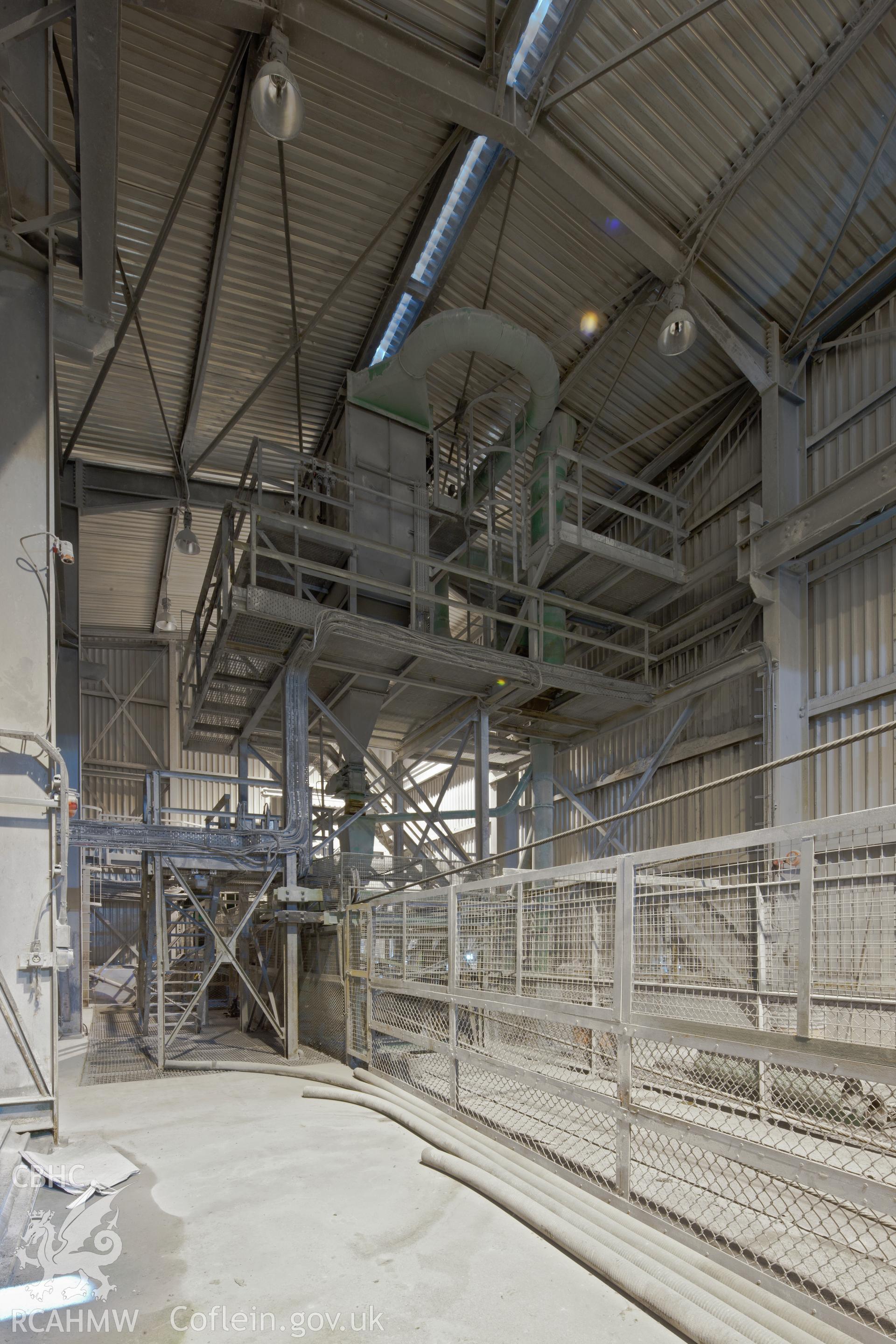 Interior of the Mainland Transfer Station, showing a storage hopper where alumina and coke particles collected from dust collectors were stored. Anglesey Aluminium, Iain Wright, 5/10/11.