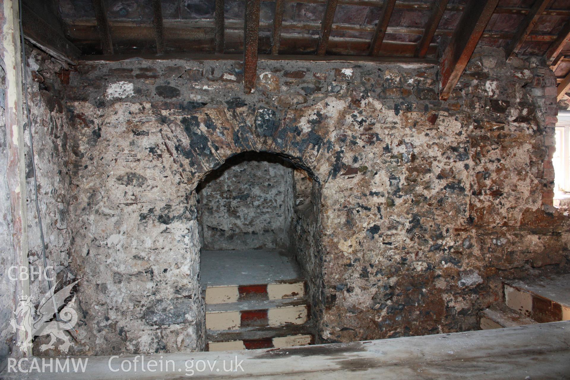 Arched opening to stair projection, from room over kitchen.