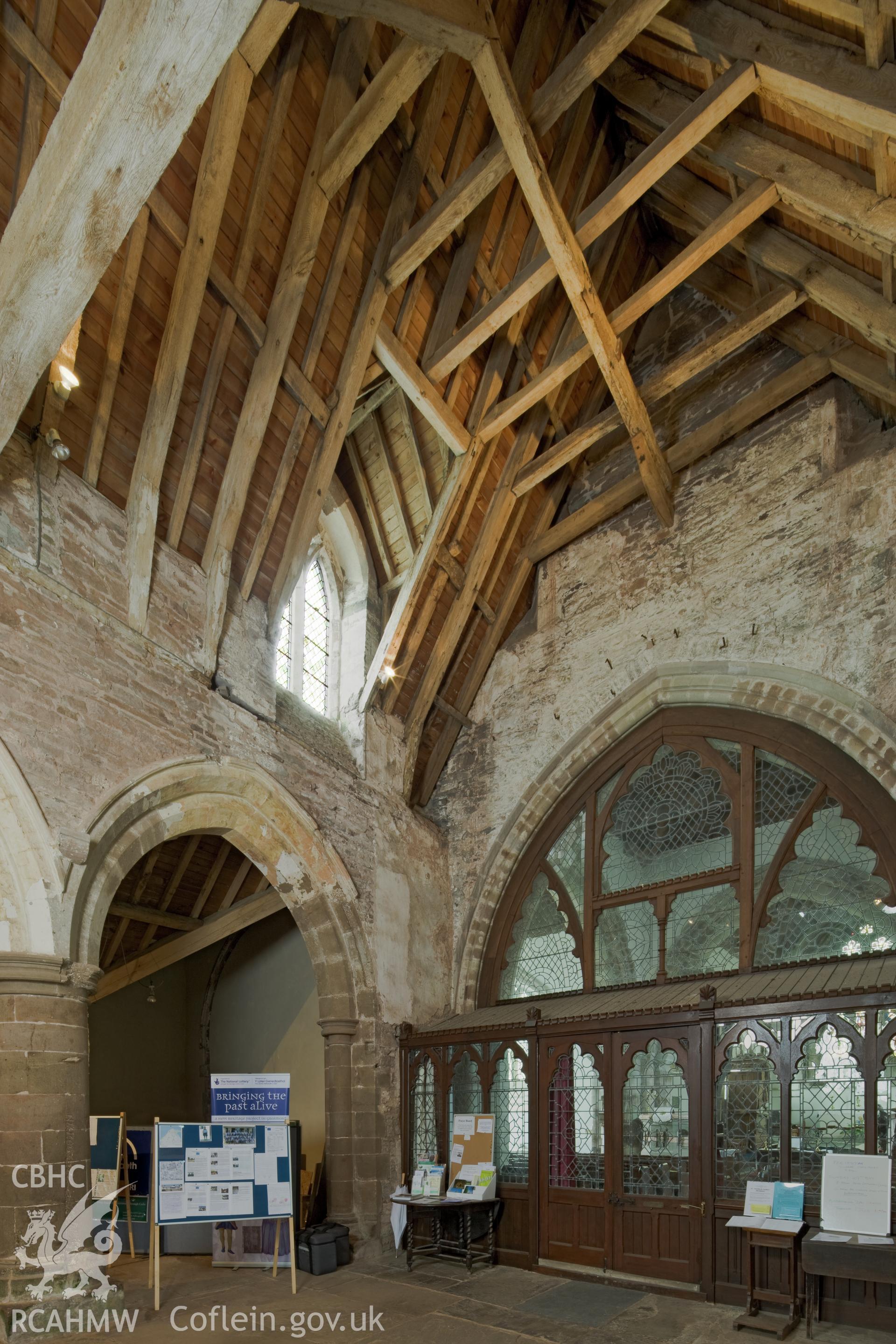 Glass screen dividing nave from church interior.