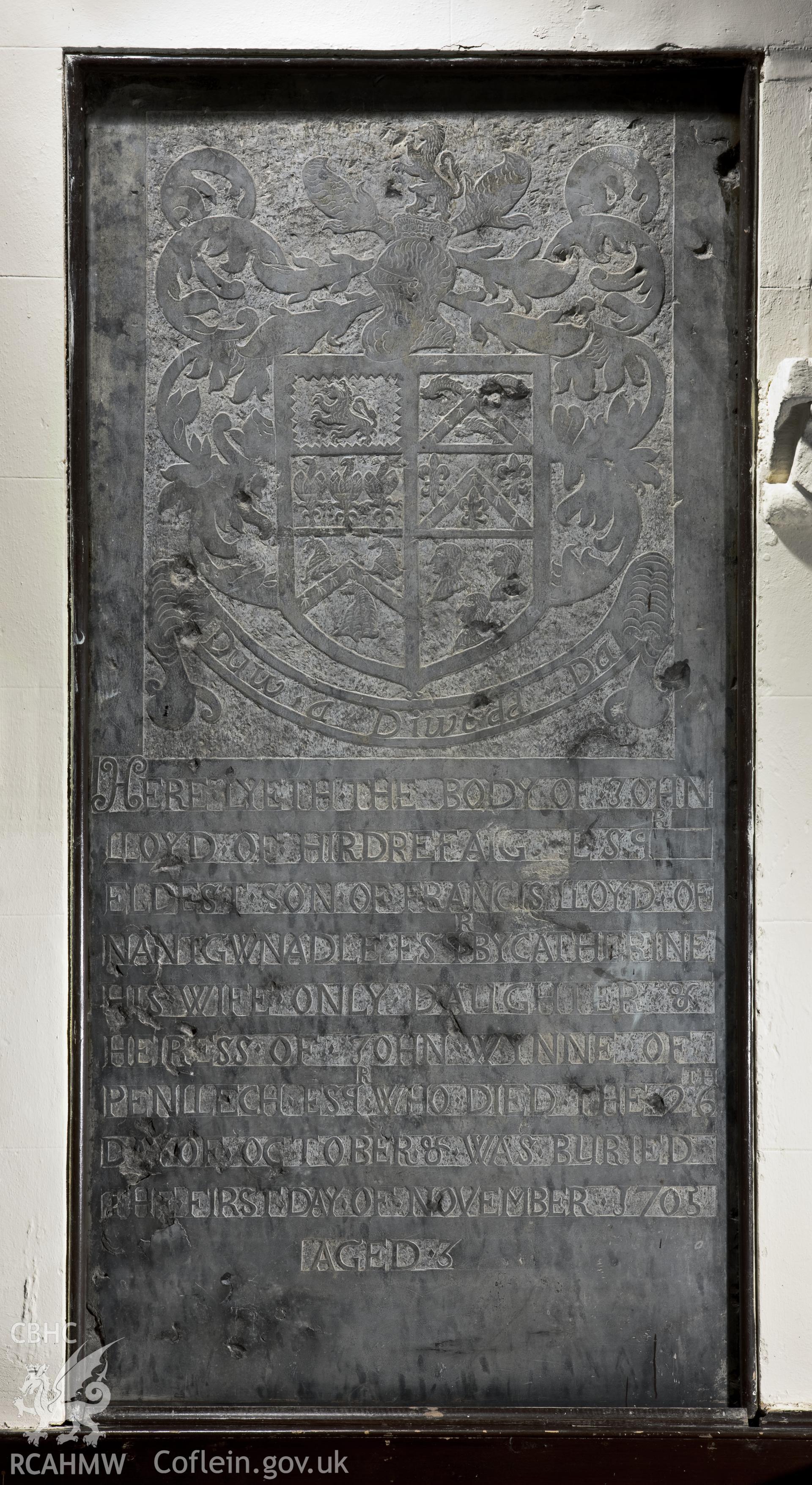Carved slate memorial slab on southeast wall.