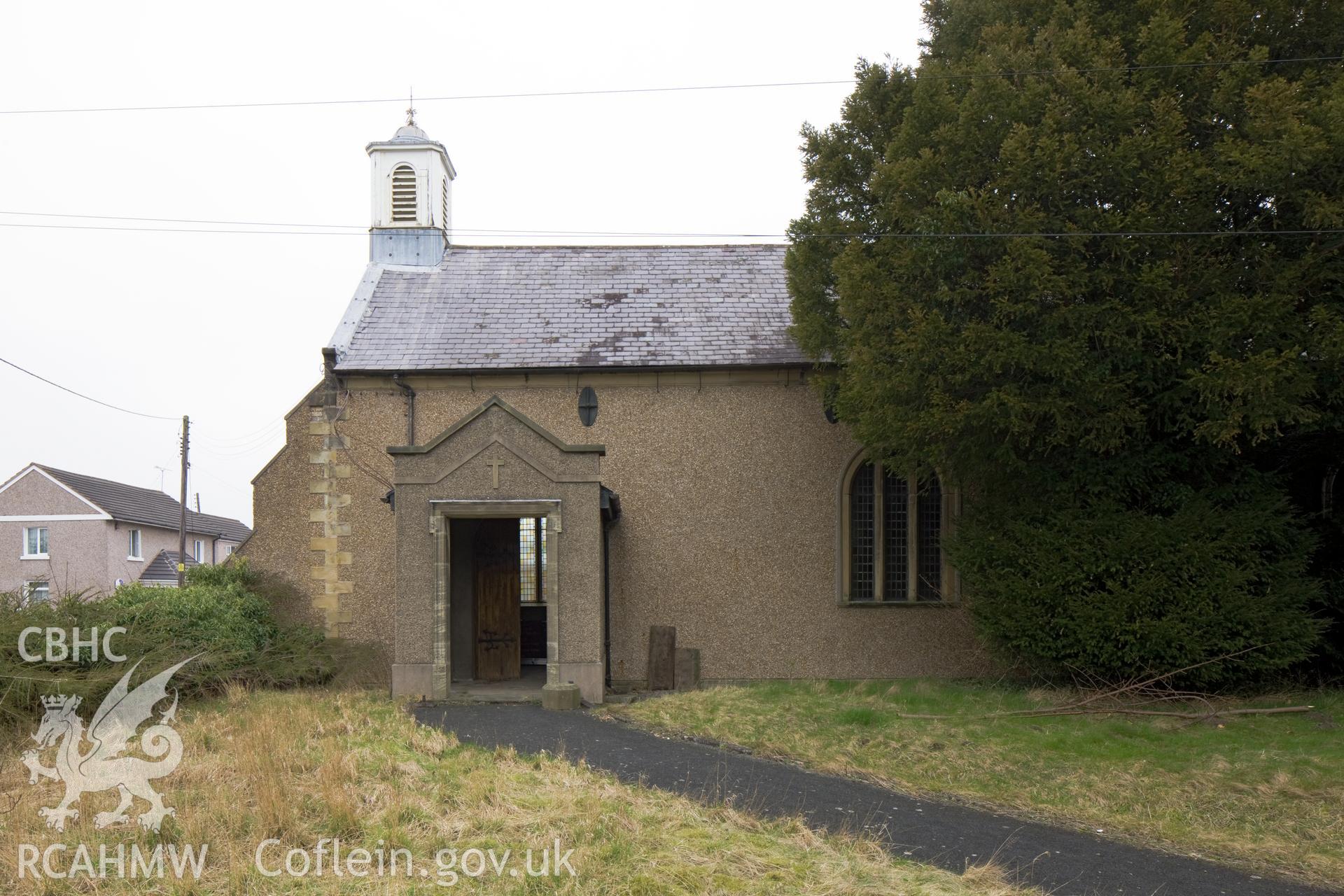 Entrance porch and bell-cote.