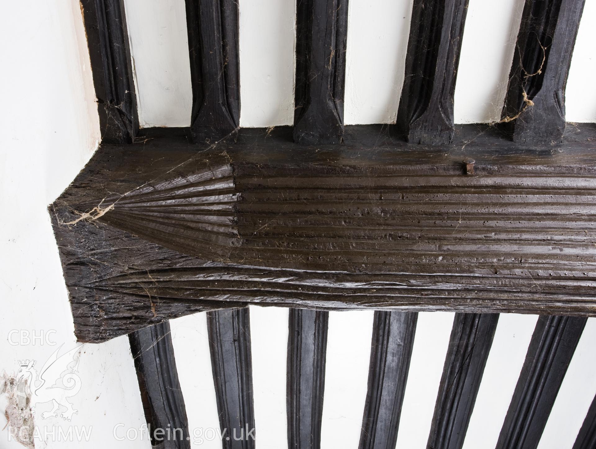 Detail of carving on ceiling beam.