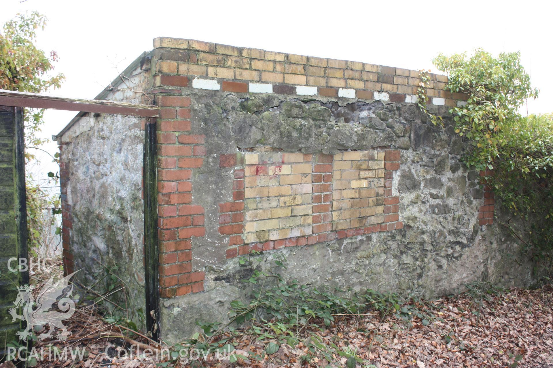 Mid-nineteenth century buildings by the side of the Pen-y-graig quarry road. They are associated with houses immediately below the road.