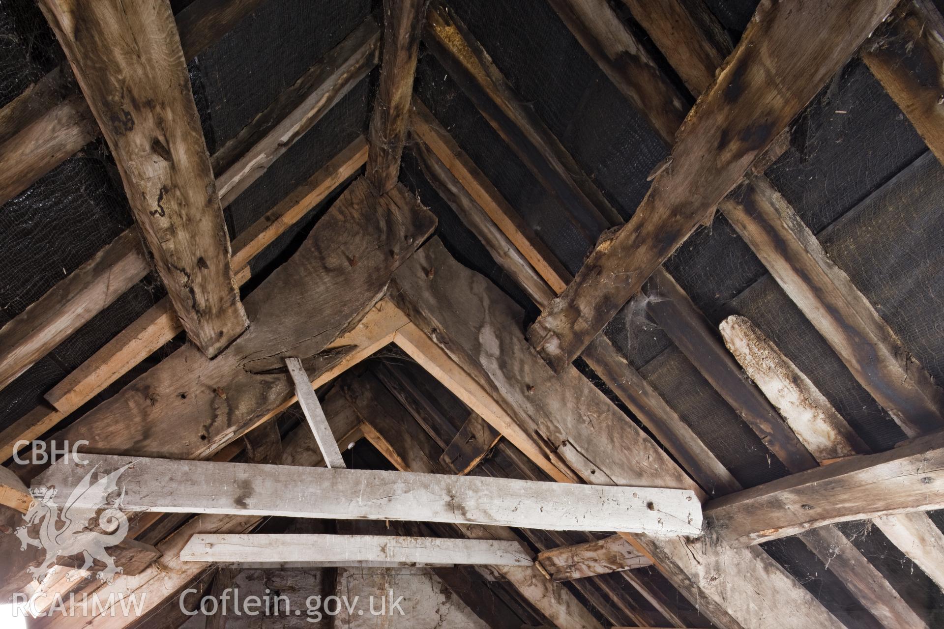 Interior of roof showing various repairs to failed roof timbers.