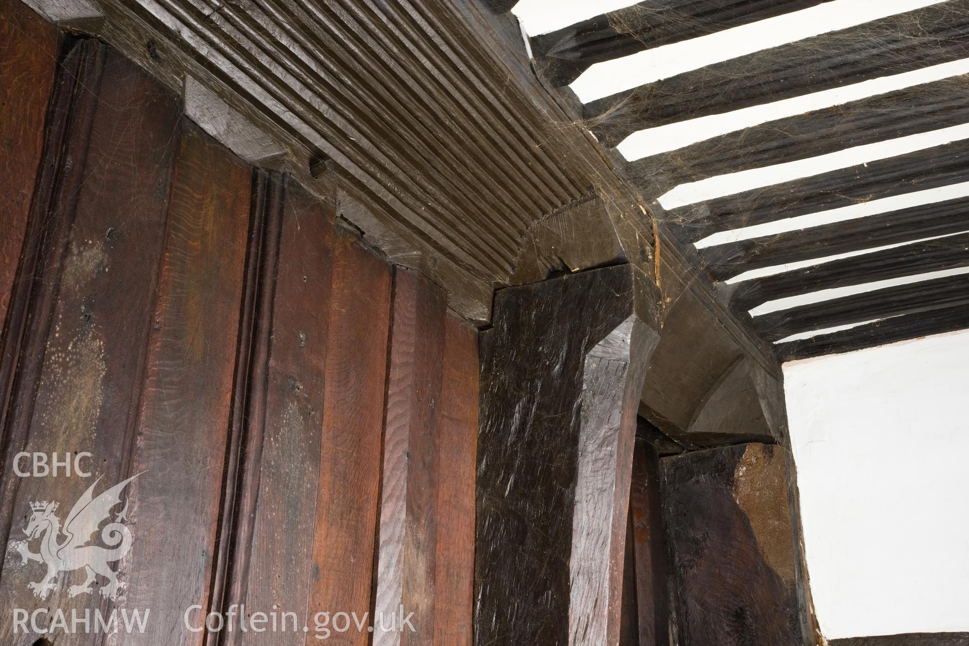 Detail of carving on ceiling beam.