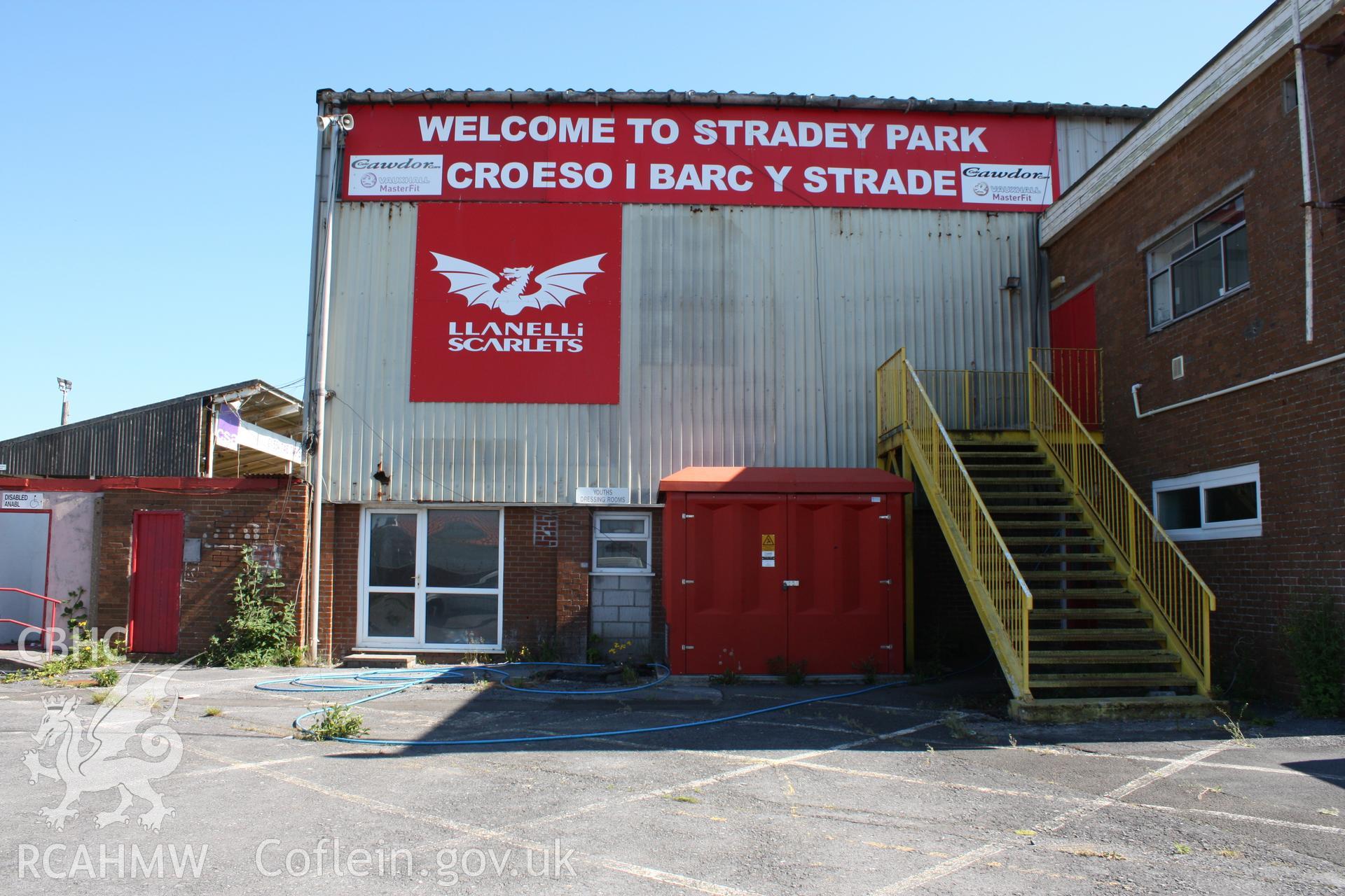 Welcome sign and entrance to changing facilities situated in the west corner of the south stand