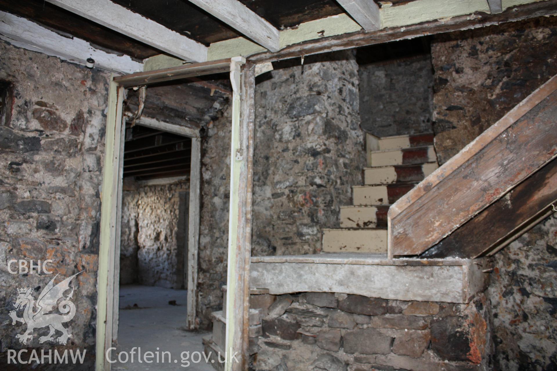 Kitchen, hall doorway to left and stairs.