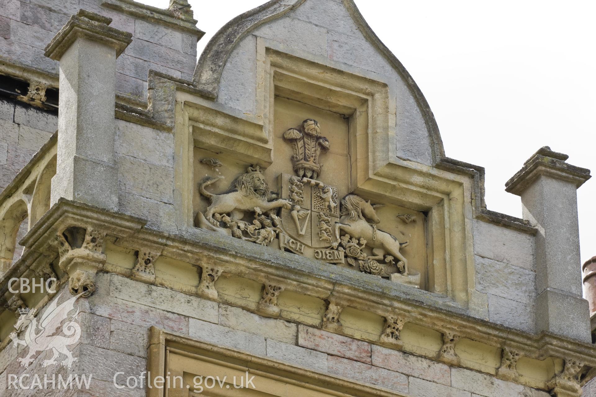 Coat of arms over entrance steps.