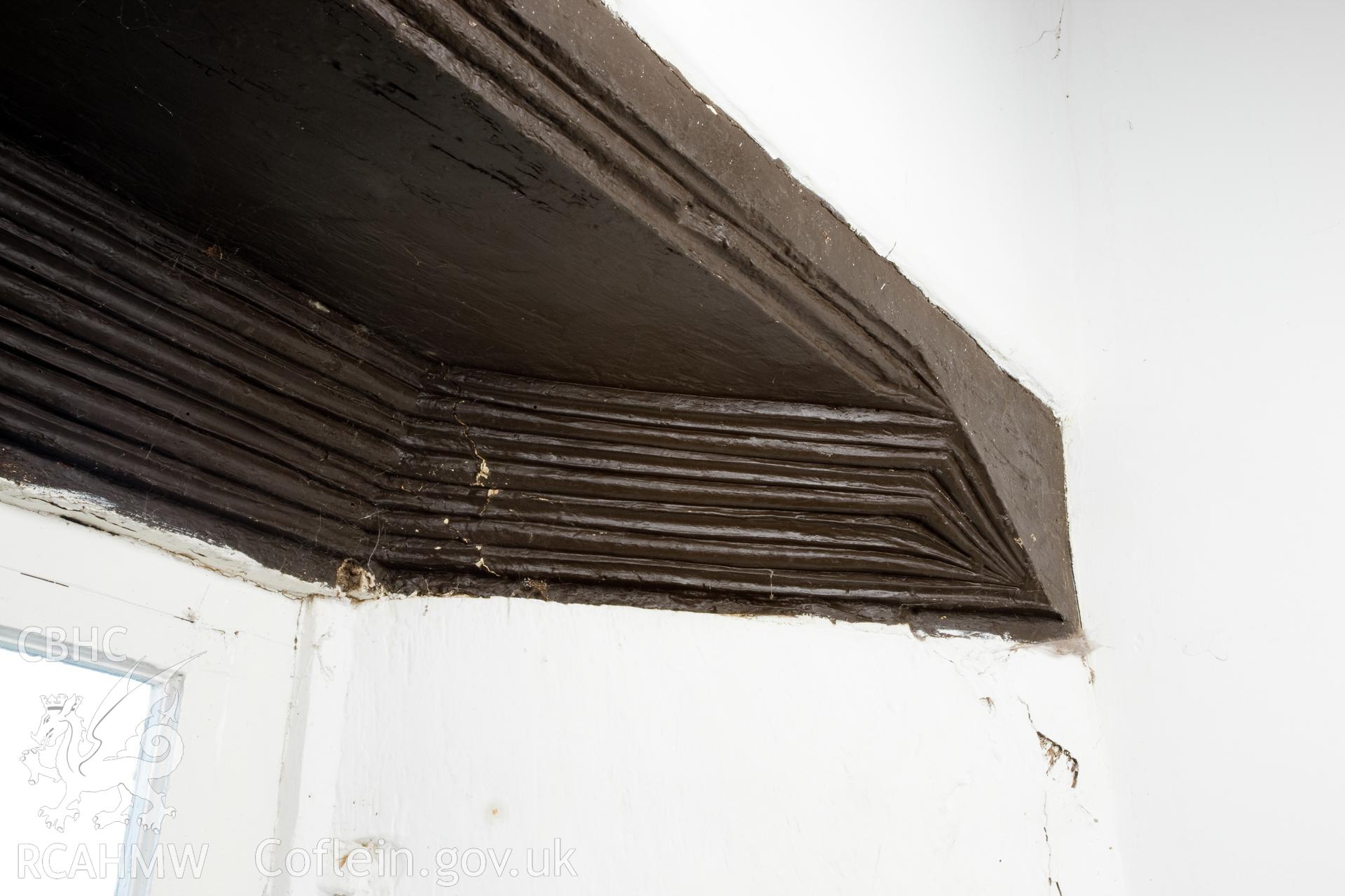 Carved moulding on interior of parlour window.