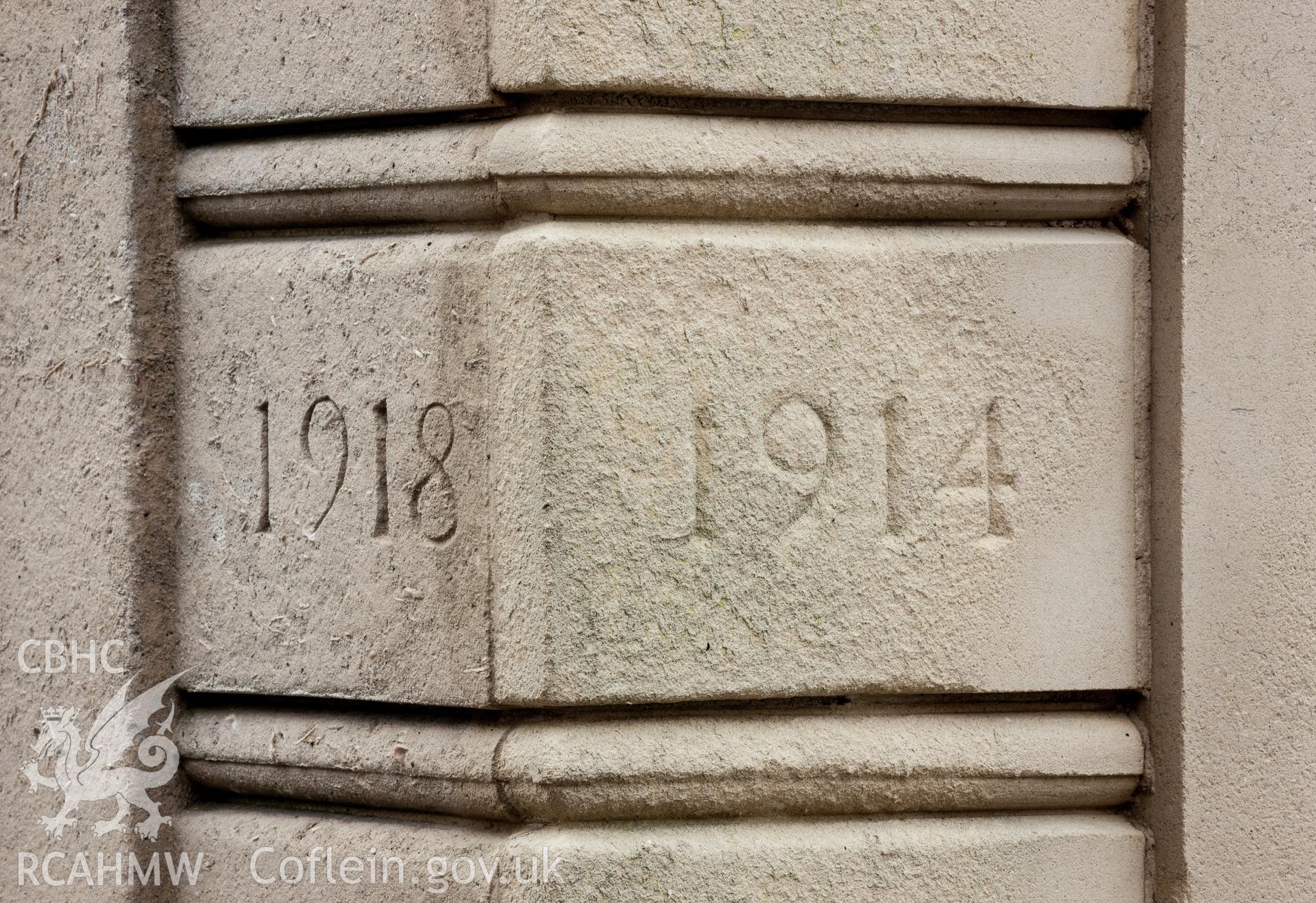 Details of original date showing deterioration of stone
