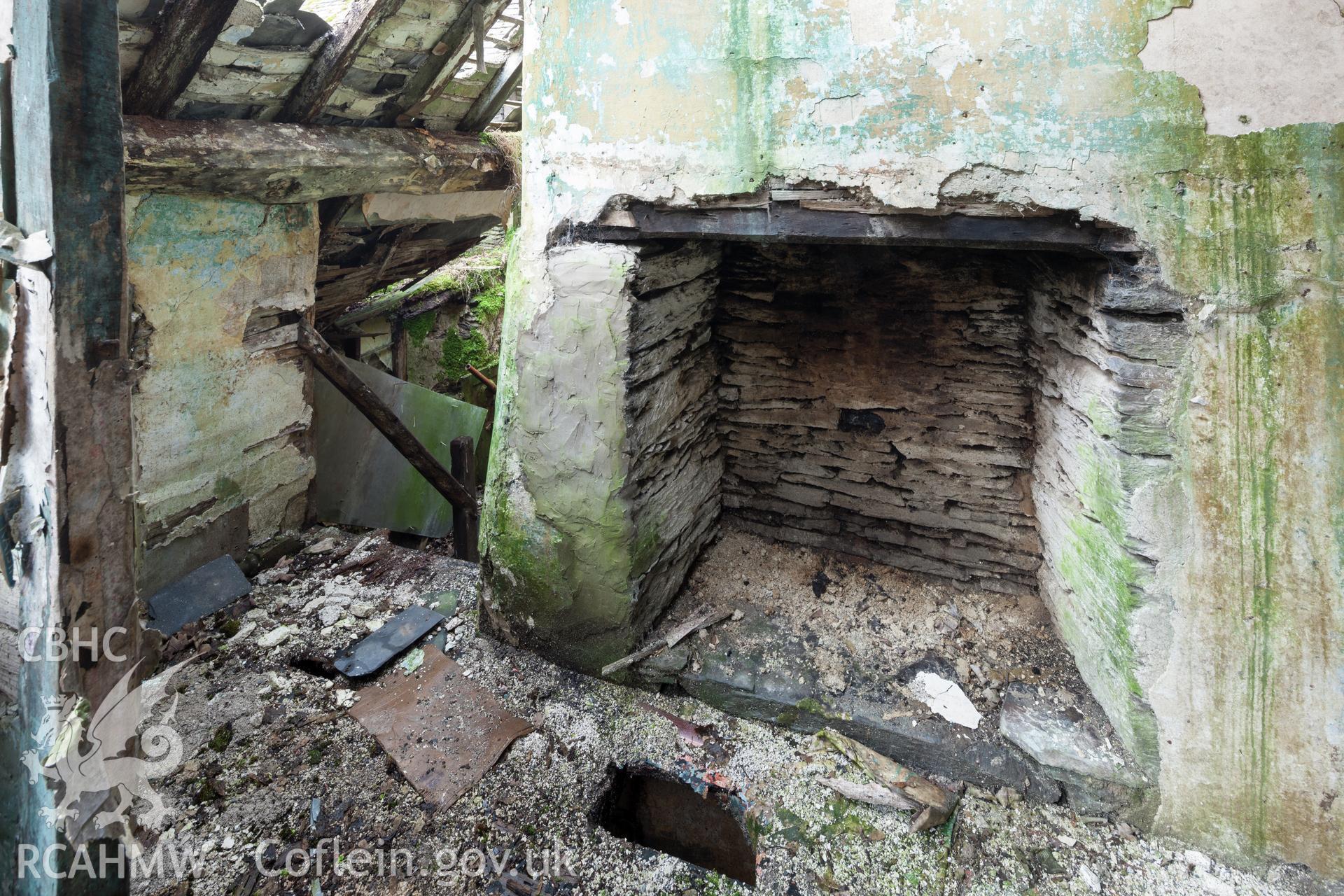 Staircase to attic and fireplace in the attic to the southeast of the chimney stack