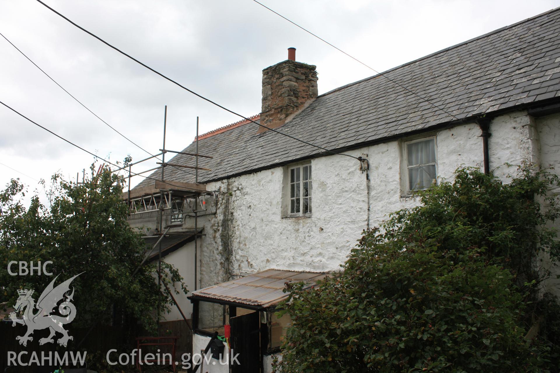 Exterior; South elevation, showing joint between early house and later extension.