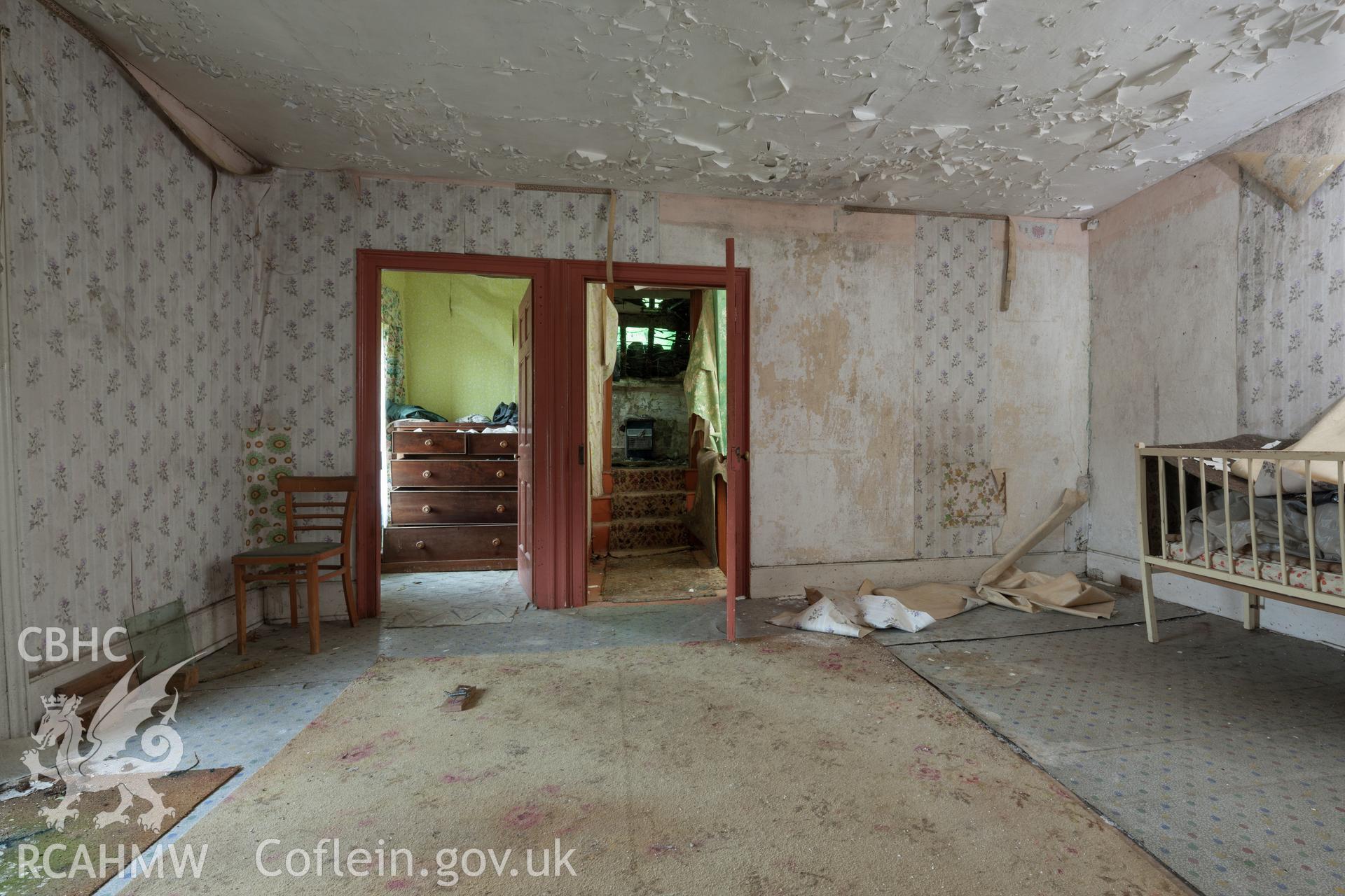 First floor bedroom on west side of later wing, viewed from the southwest.