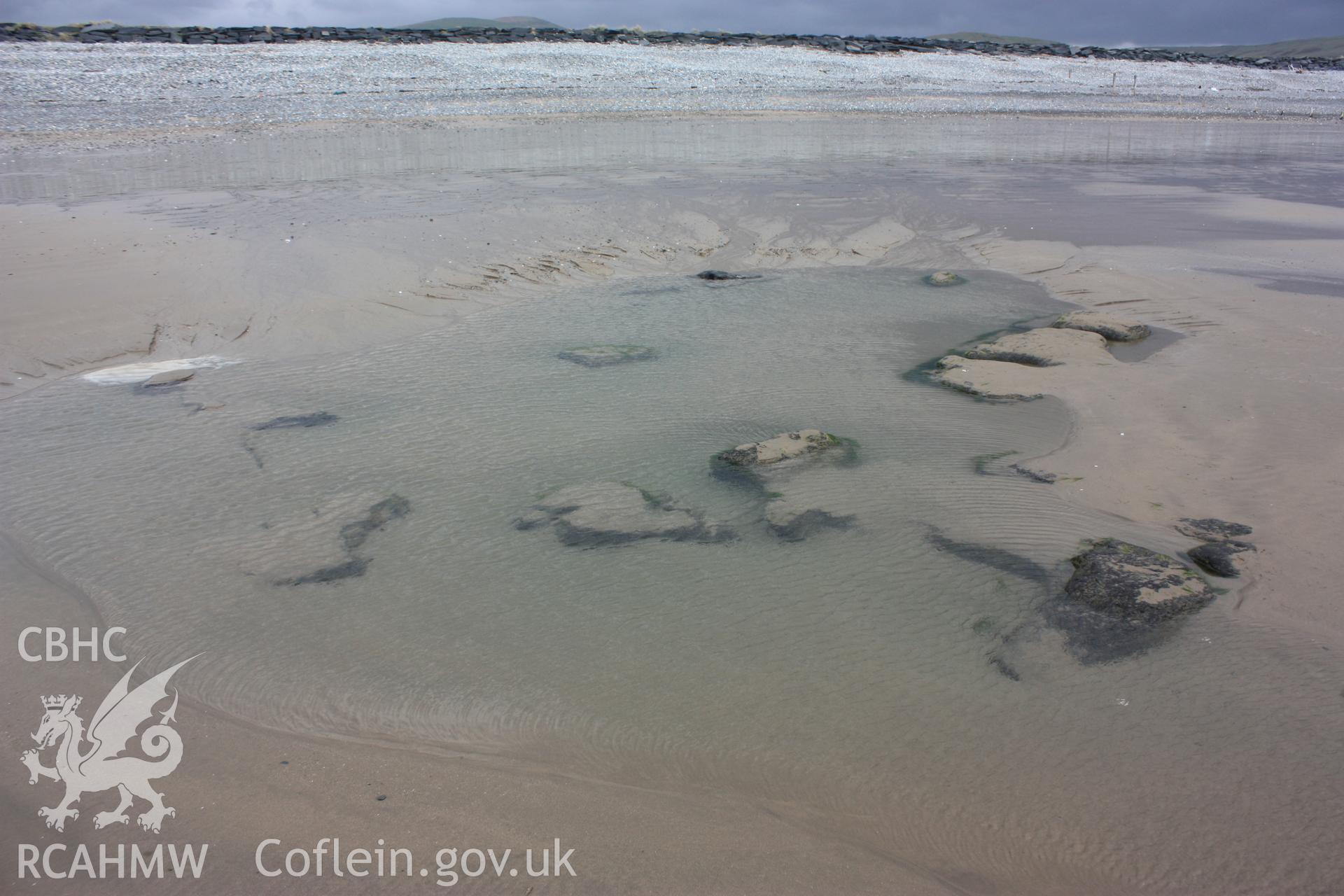 Small area of peat exposed near storm water outfall