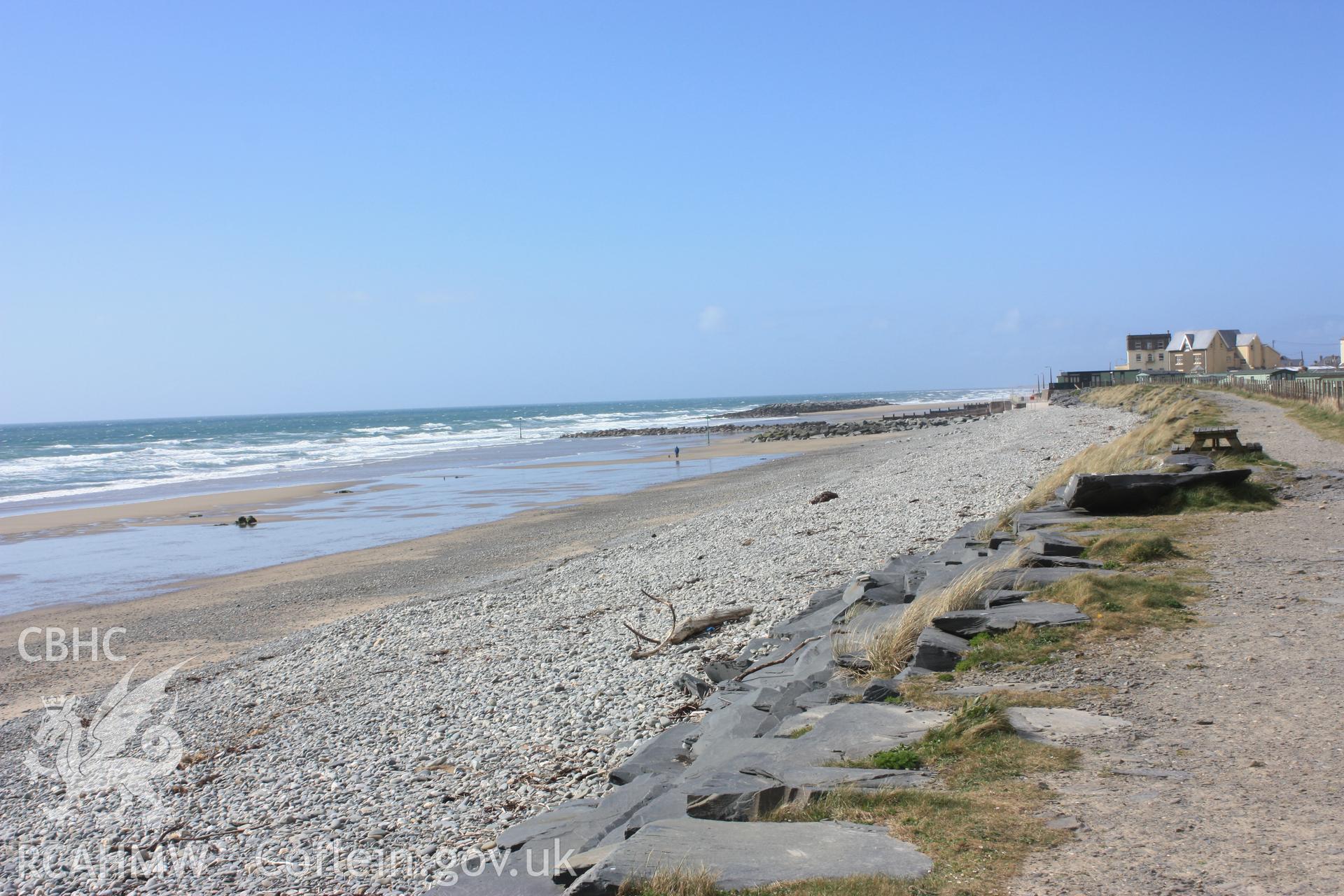 Tywyn beach looking north from coast path showing sparse distribution of exposed tree root systems