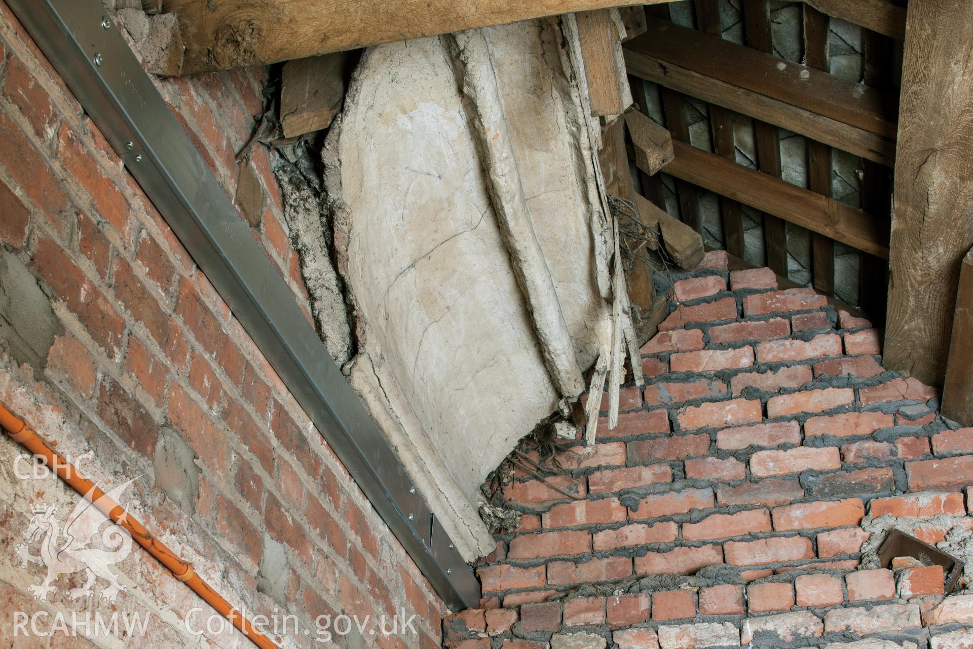 Detail of plaster roof cornice, covered by later extension