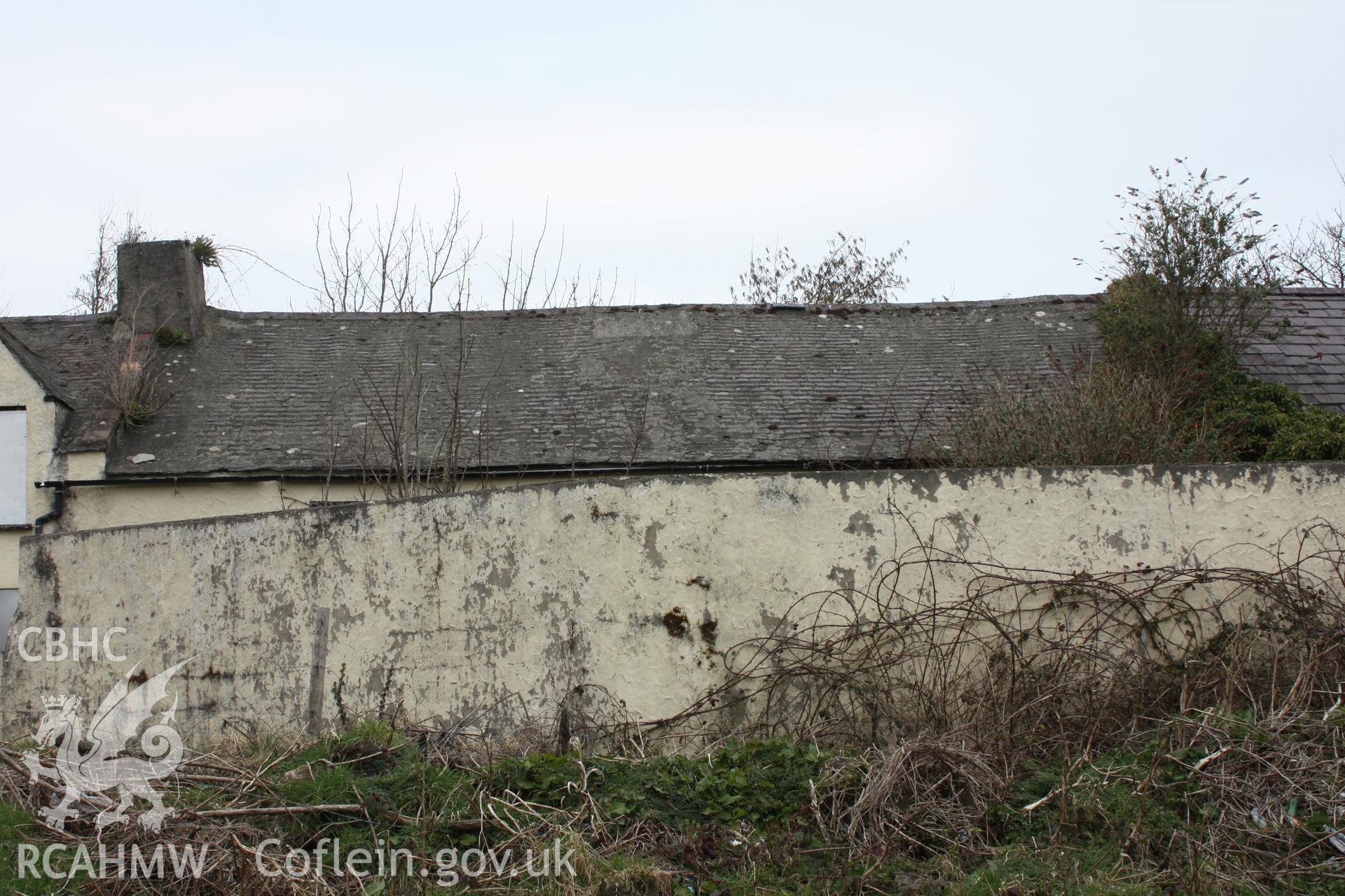 Exterior; yard wall and roof of number three and four