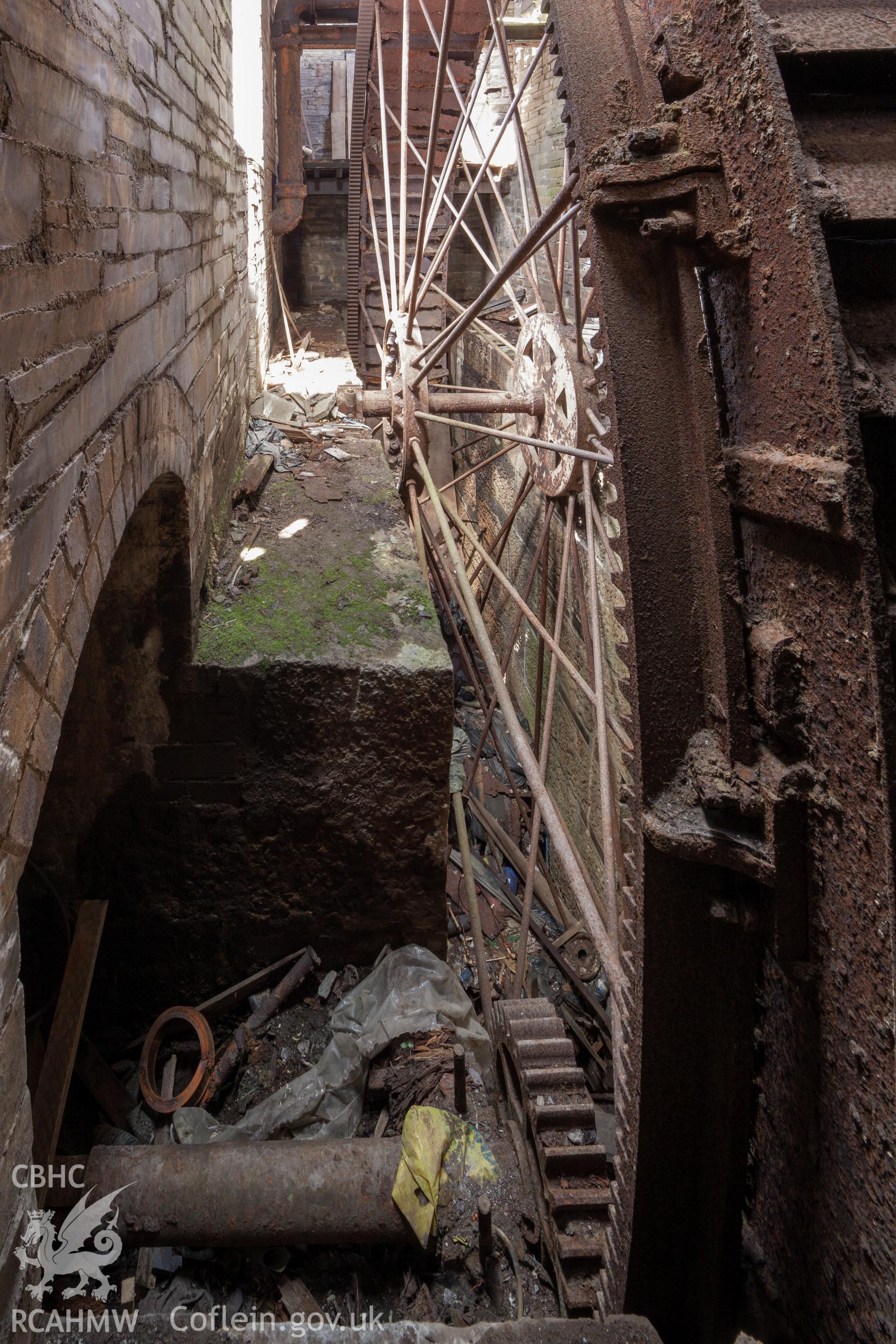 View of waterwheel from the south southeast, drive shaft visible in foreground