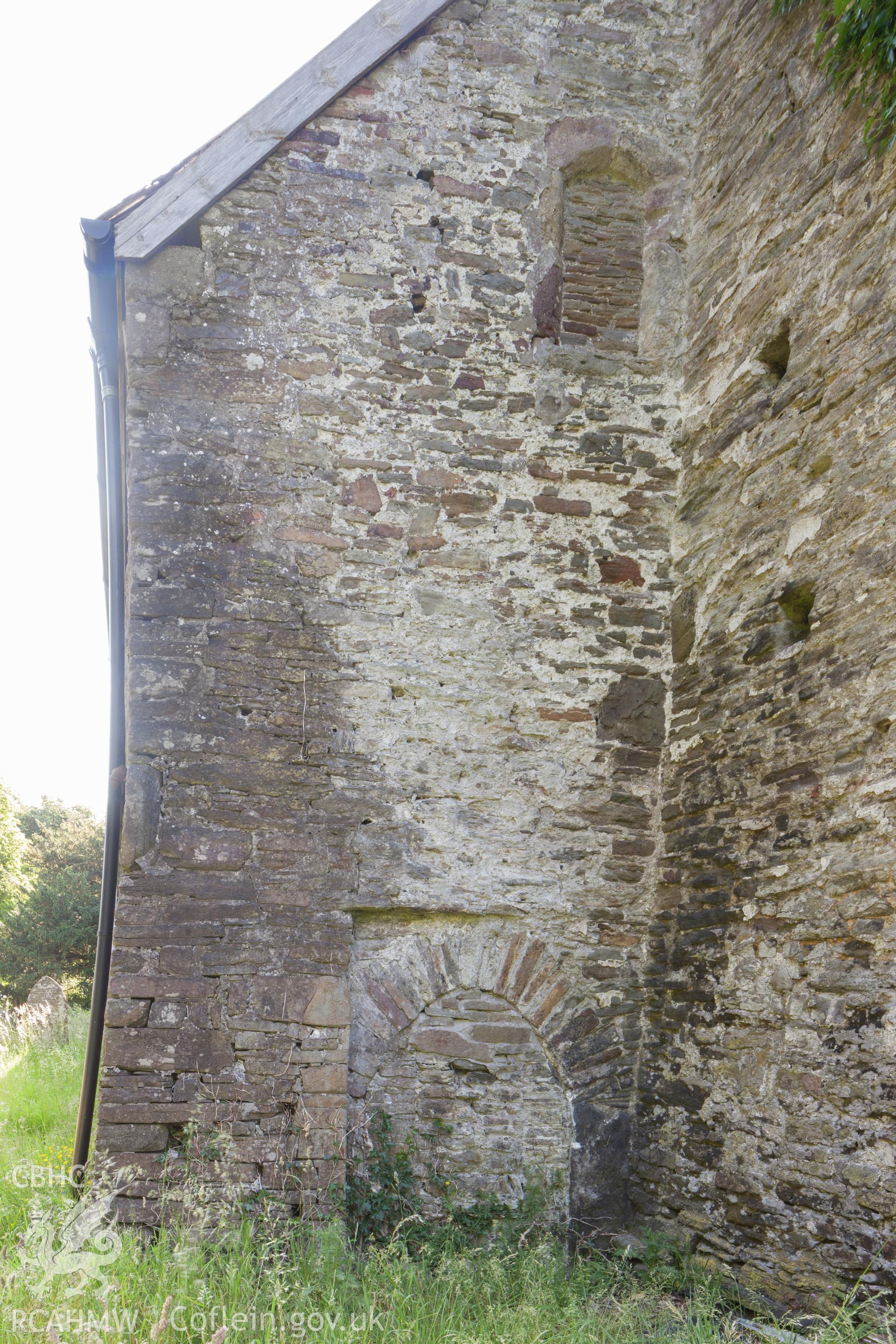 Blocked openings behind the tower on the west wall