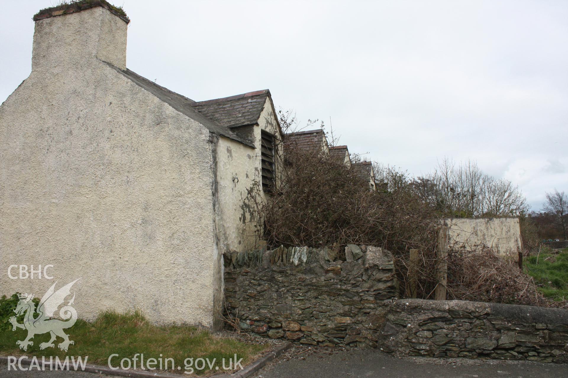 Exterior; 3/4 view of west gable and south elevations