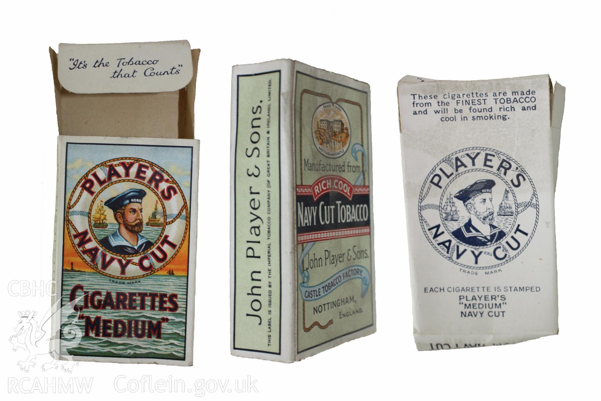 Player's Navy Cut Cigarettes "Medium", empty packet found between floorboards of first floor front bedroom. Design introduced in 1950s to a line that was marketed in the early 20th century.