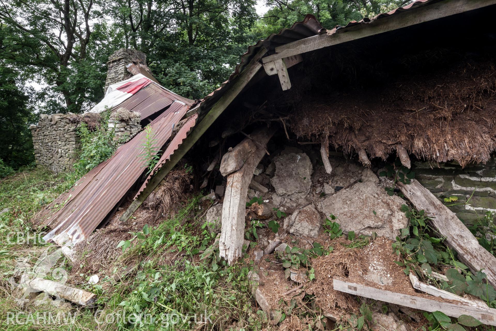 Thatch and roof framing under corrugated iron