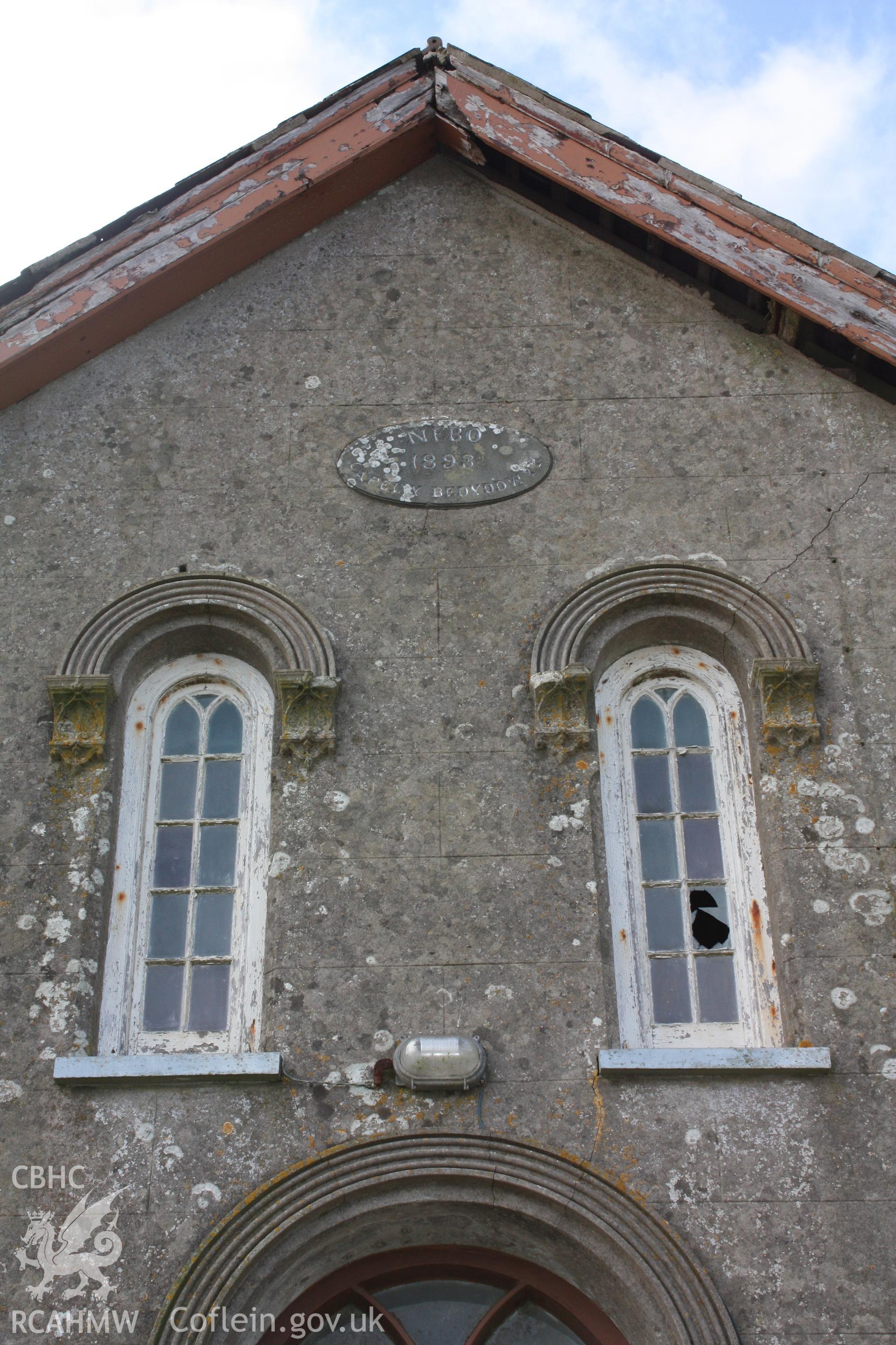 Date plaque above central dorway and detail of windows