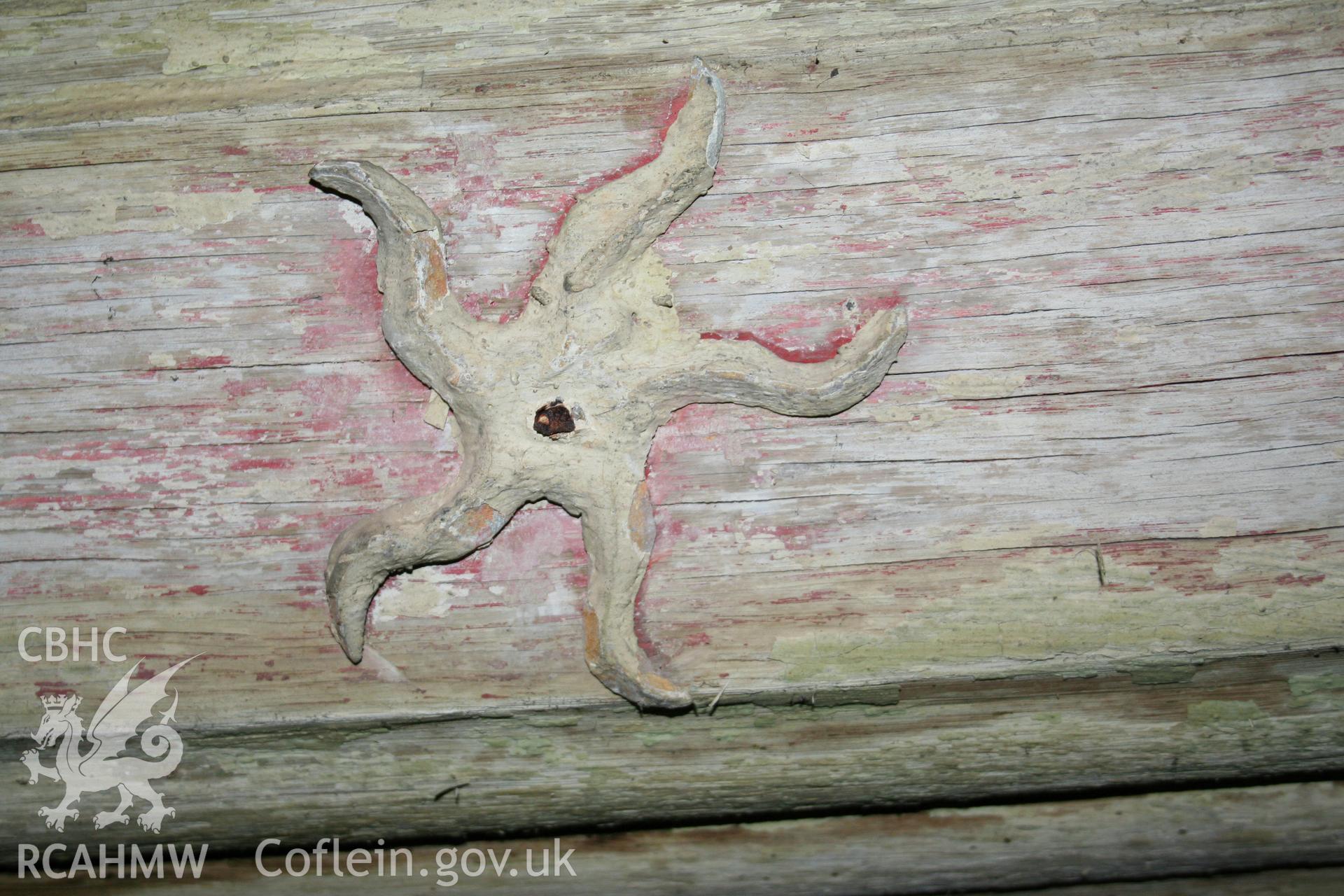 Lead star showing remains of gold leaf and red paint