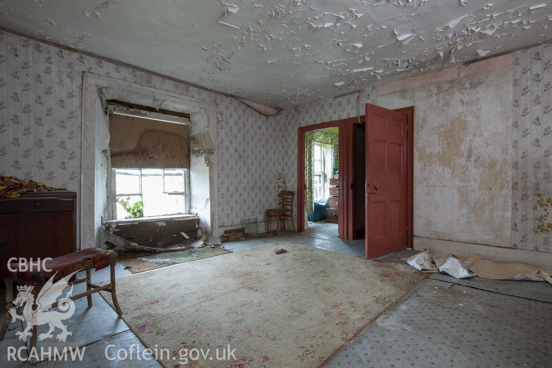 First floor bedroom on west side of later wing, viewed from the south.