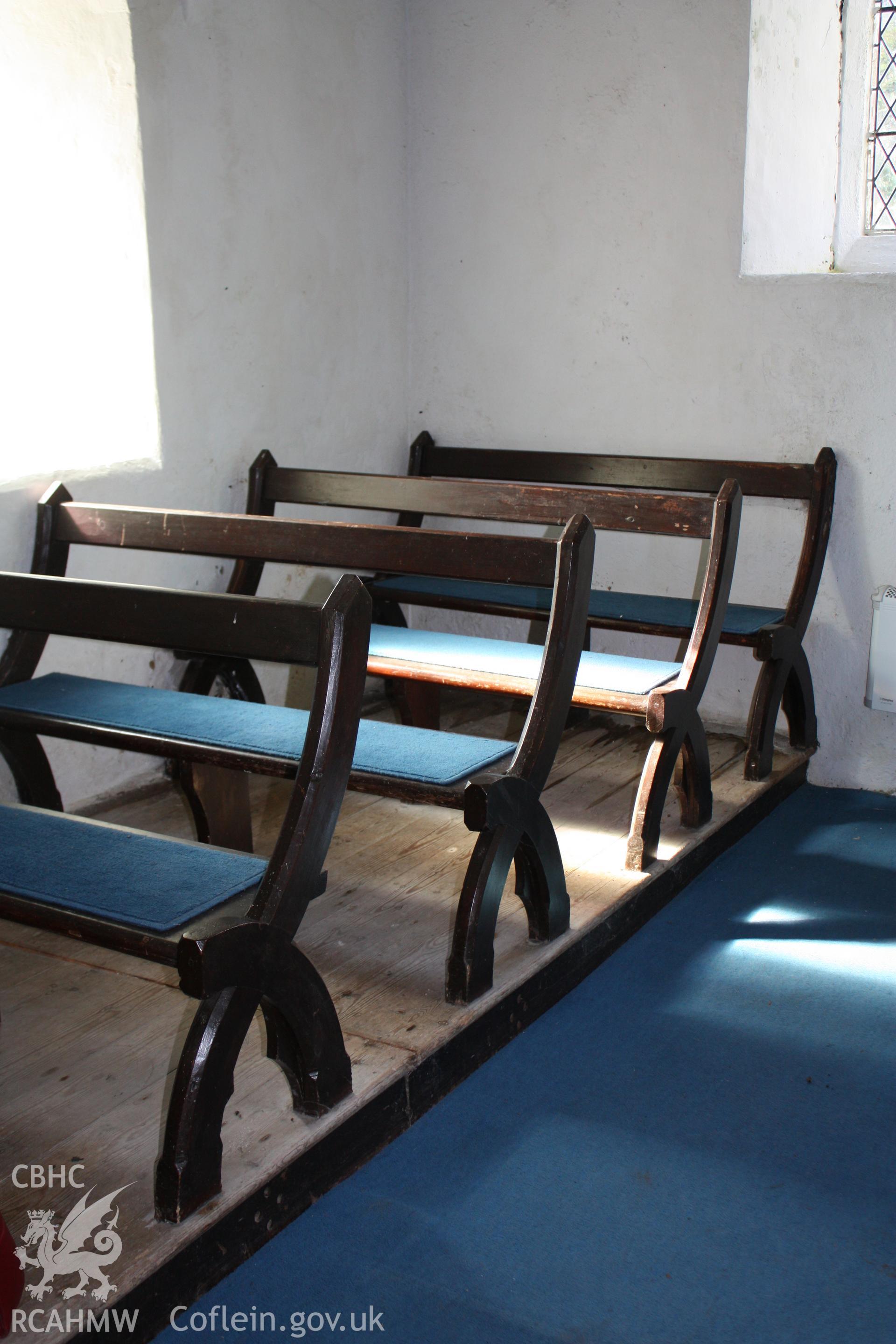 Wooden benches for the congregation at western end of nave