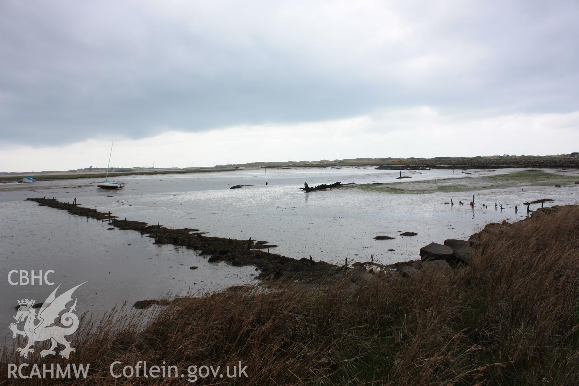 Former landing piers (and hulk NPRN 418917) on the northern bank of Pensarn harbour