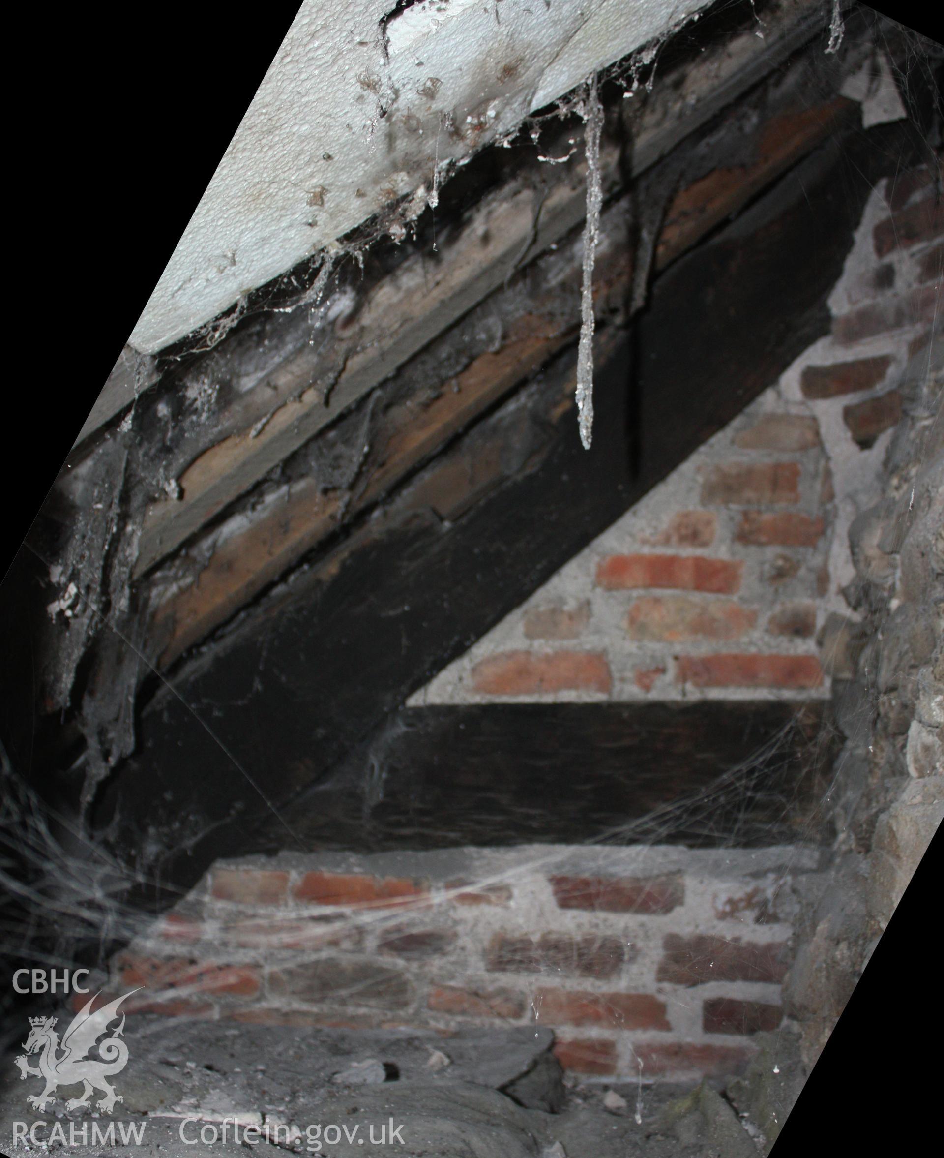 Internal; Truss sited to front of chimney stack, smoke-blackening suggest earlier open hall.