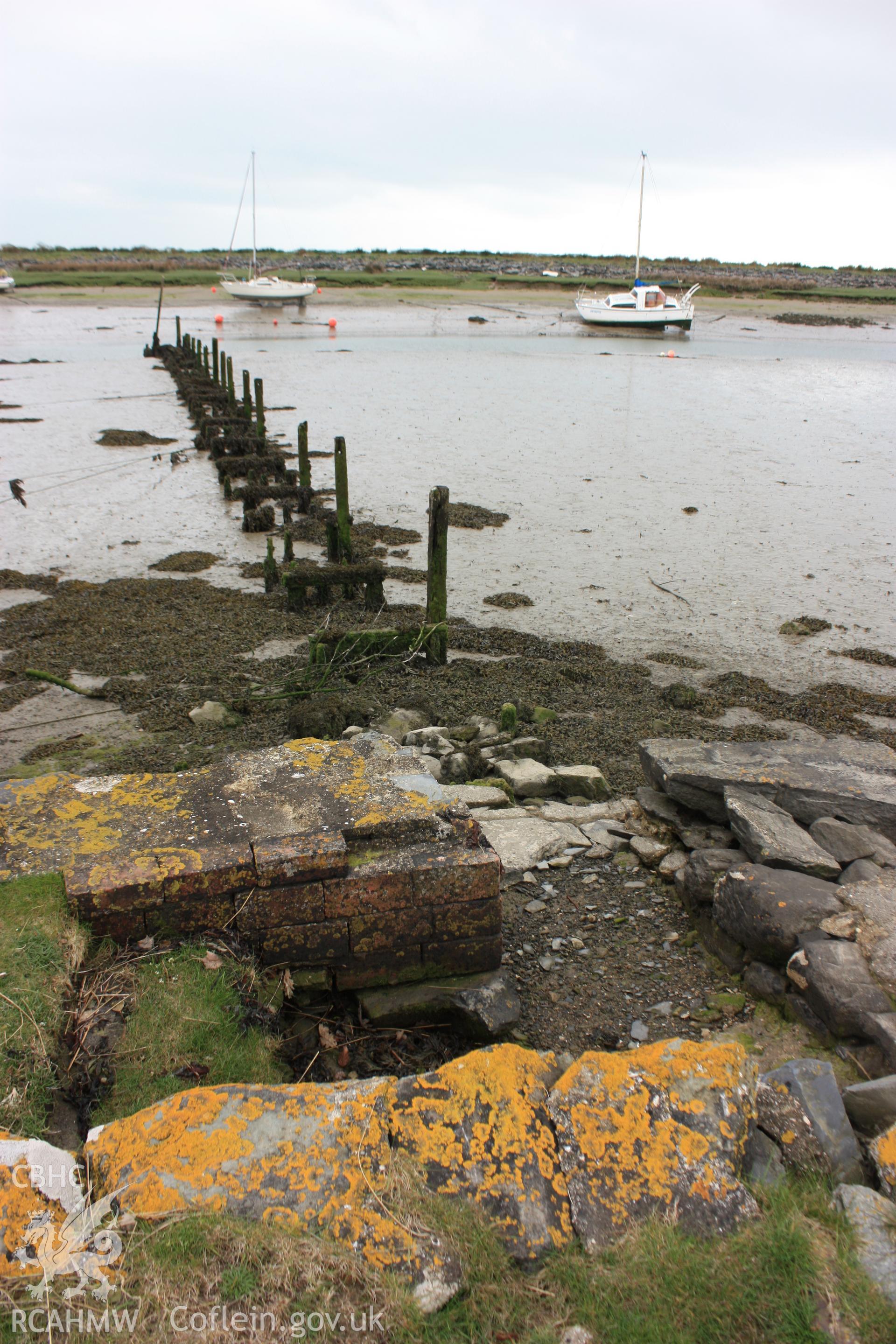 Remain of landing pier and steps stones on the northern bank of Pensarn harbour