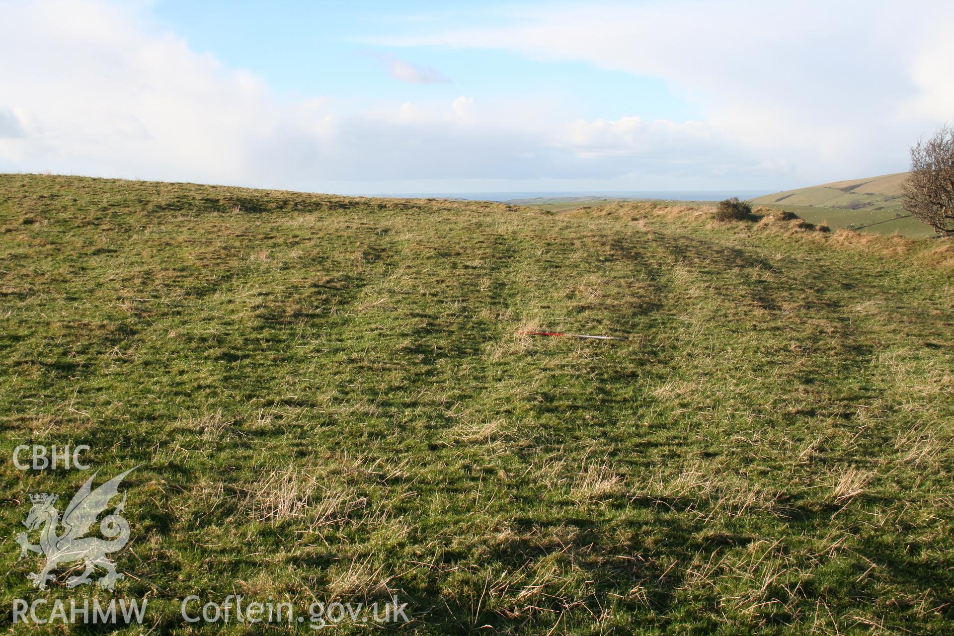 Ridges seen from the south-east, 1m scale; hillfort rampart to right of picture.