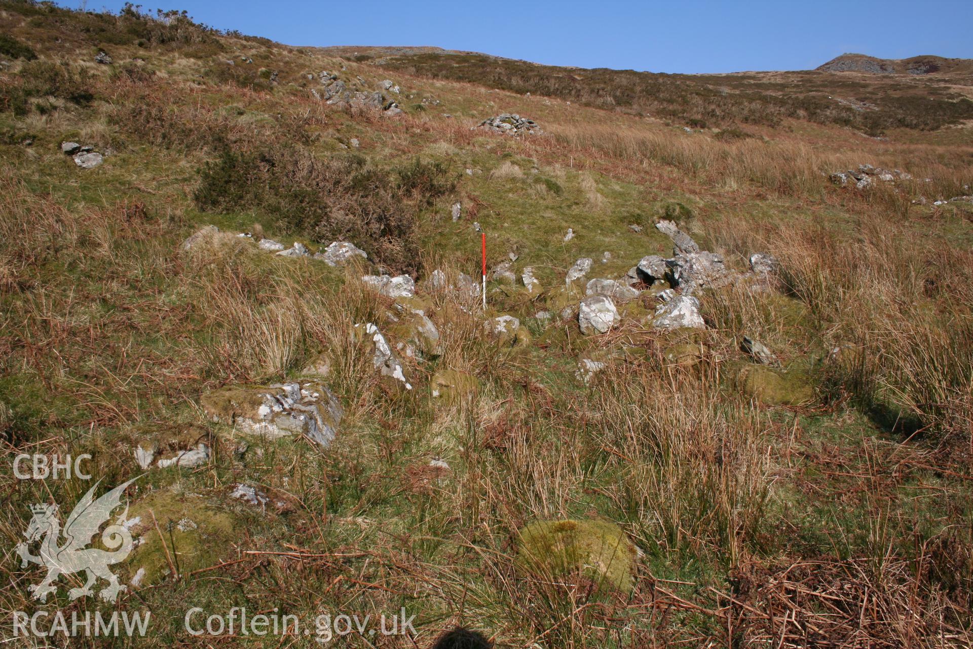 View along 'passage' of shelter from the west; 1m scale.