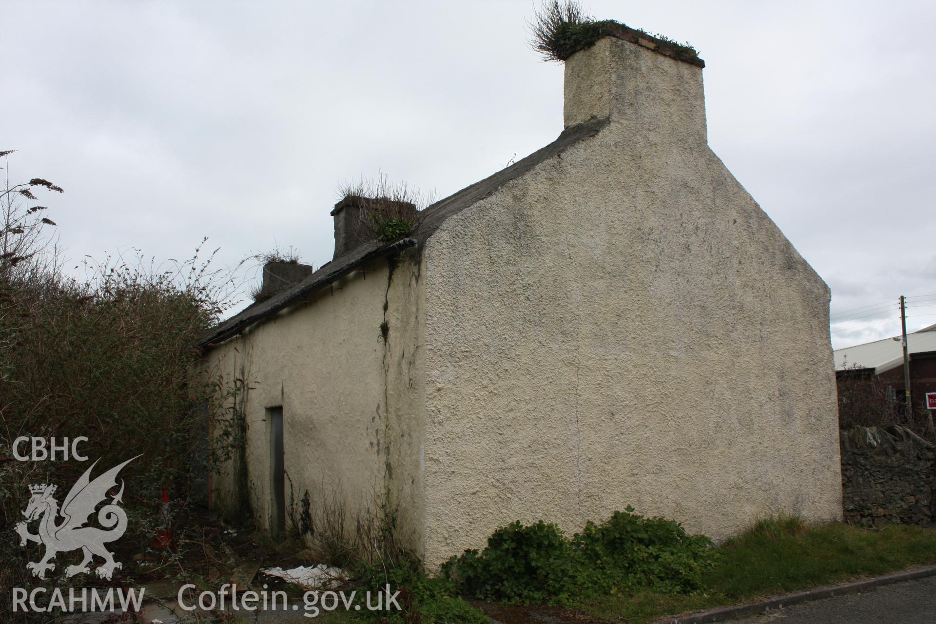 Exterior; 3/4 view of north and west gable elevation
