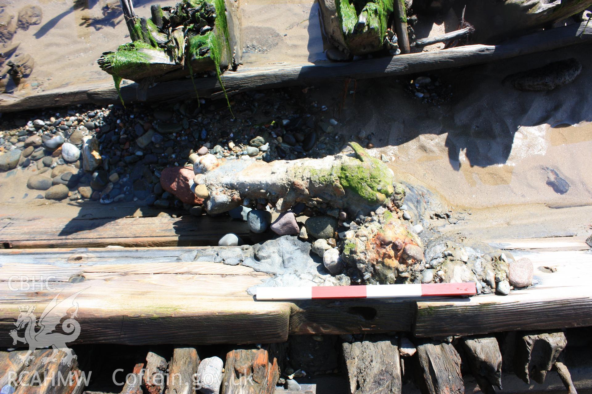 Concreted metal object attached (?) to the ceiling planking portside (with photoscale)