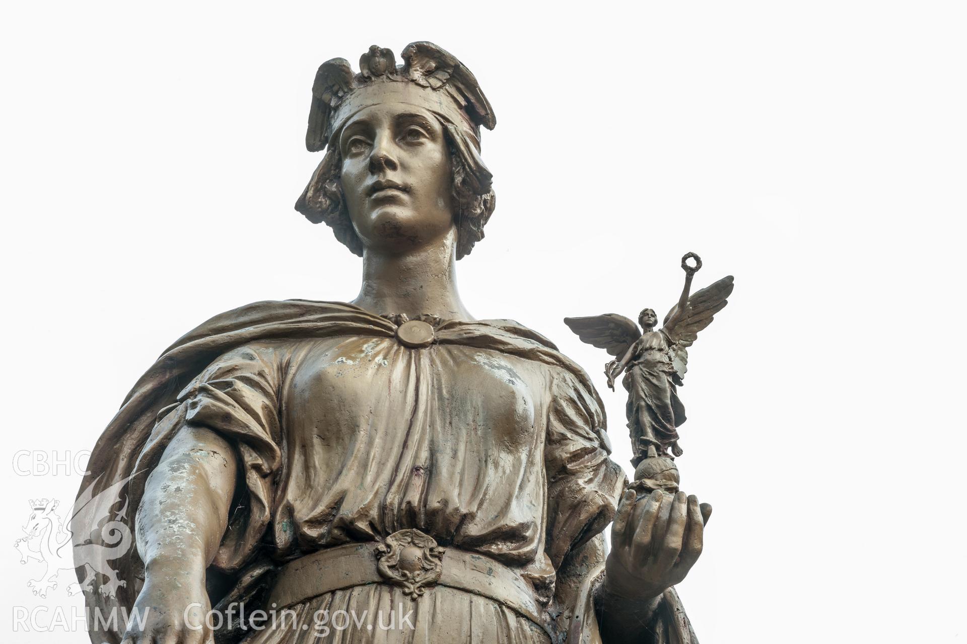 Detail of upper torso from the southeast