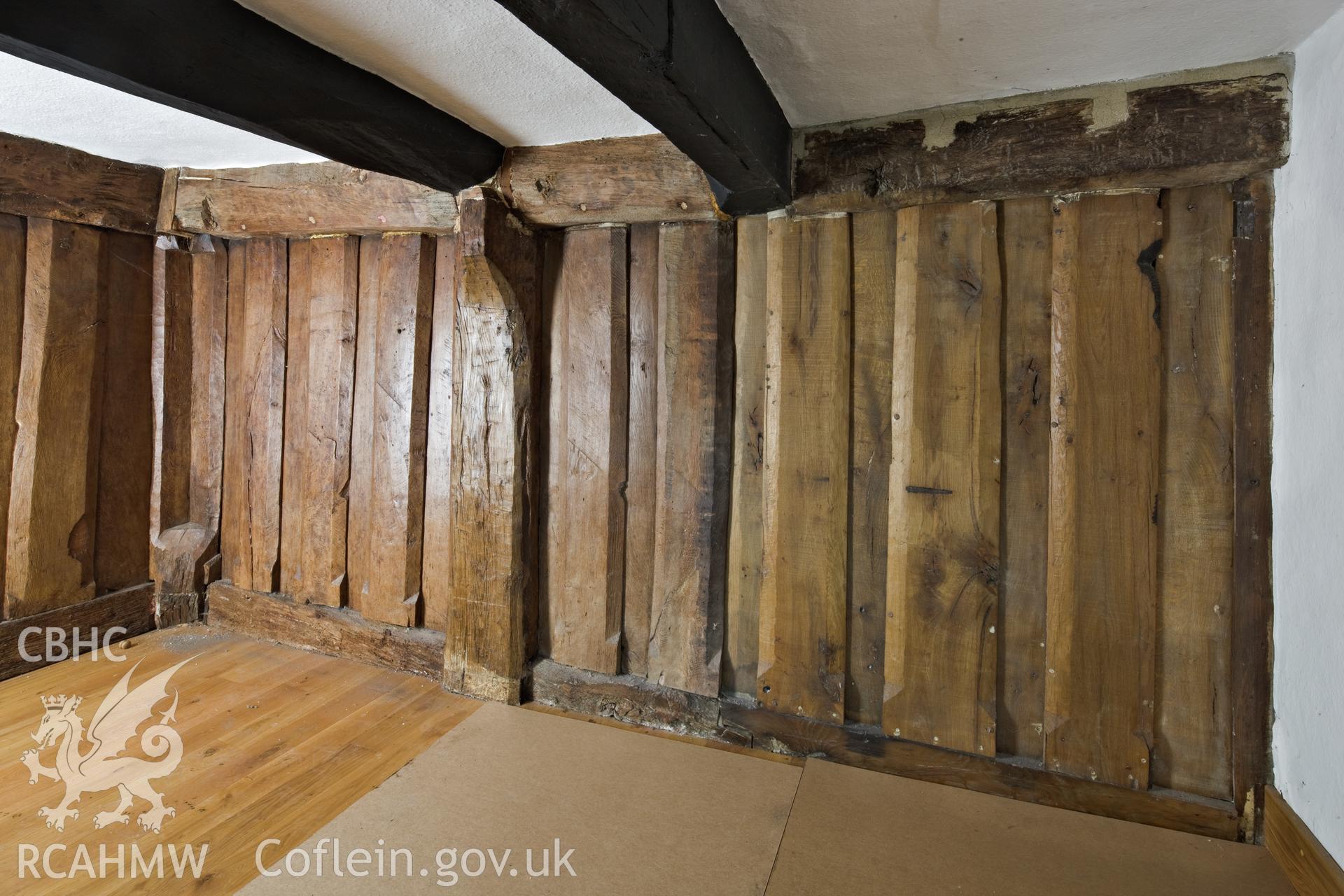 Interior post and panel partitions in chamber above hall.
